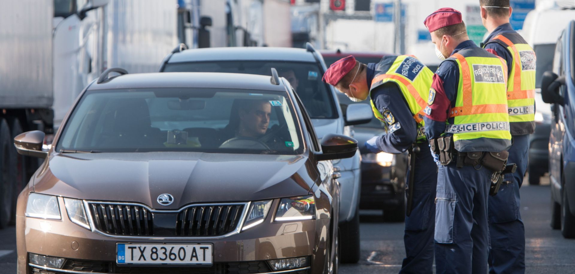 Hungarian police officers check cars at the Nickelsdorf-Hegyeshalom border crossing on the Austrian-Hungarian border on March 18, 2020. 