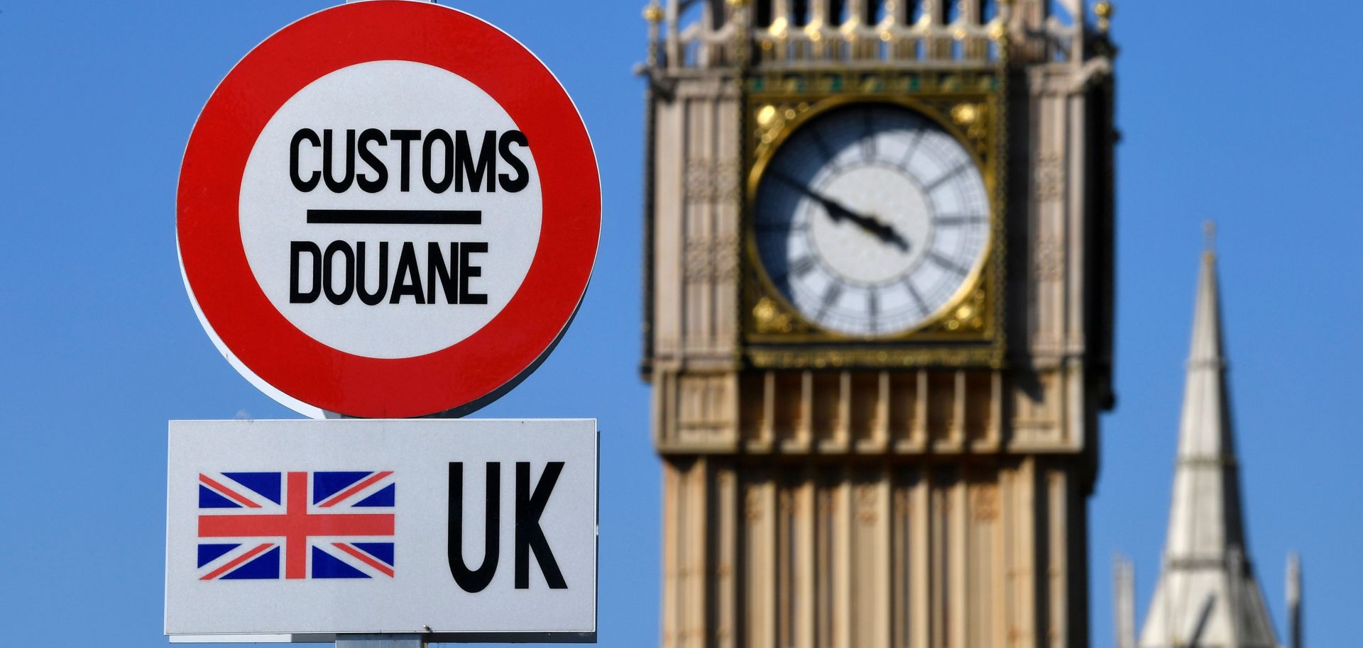 A model of a customs road sign is seen at the mock U.K.-EU border, with a mock Big Ben in the background, at the Mini-Europe theme park in Brussels, Belgium, on May 20, 2020.