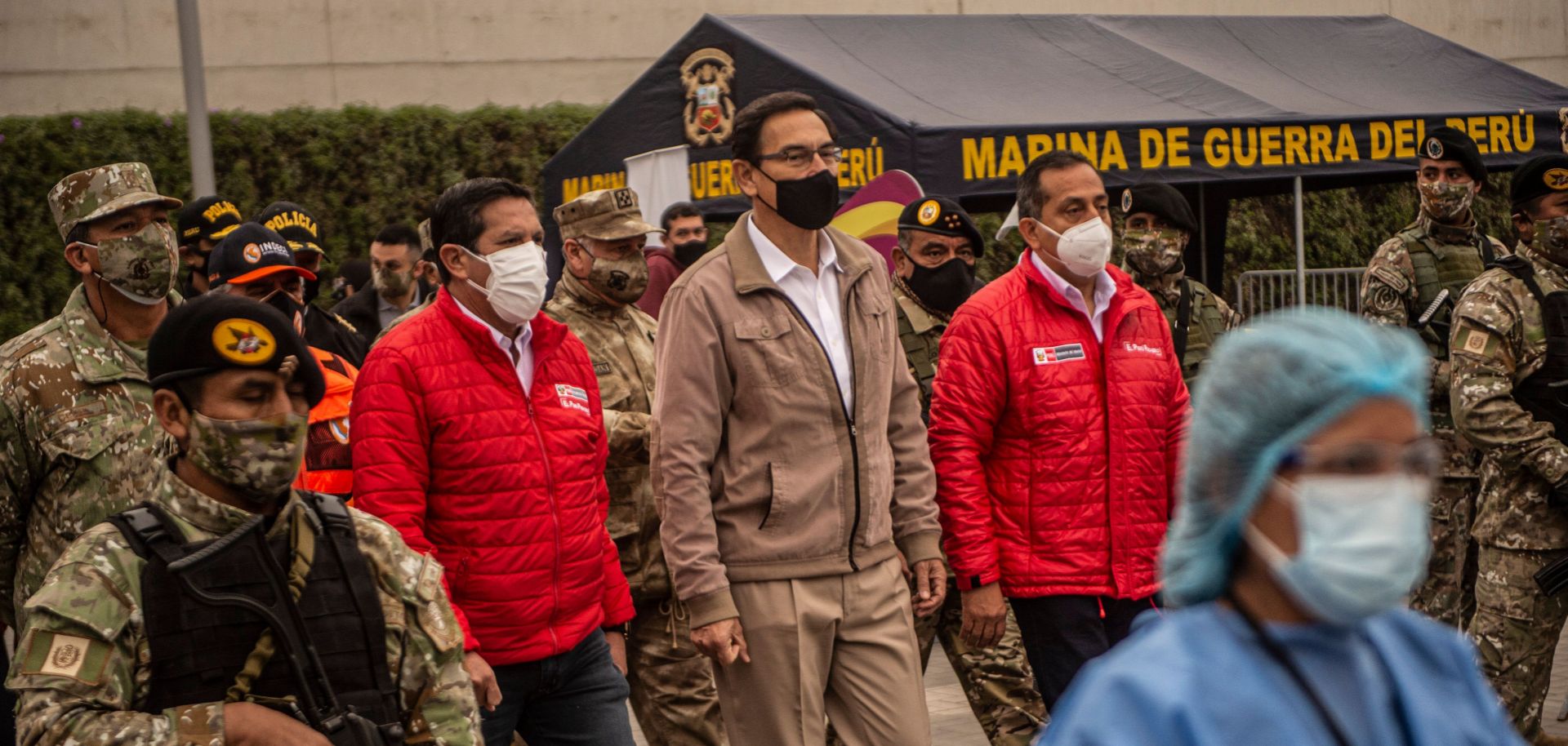 Peruvian President Martin Vizcarra (center) arrives to oversee the distribution of essential products among those in need amid the country’s COVID-19 crisis in Villa Maria del Triunfo, Peru, on Sept. 15, 2020. 
