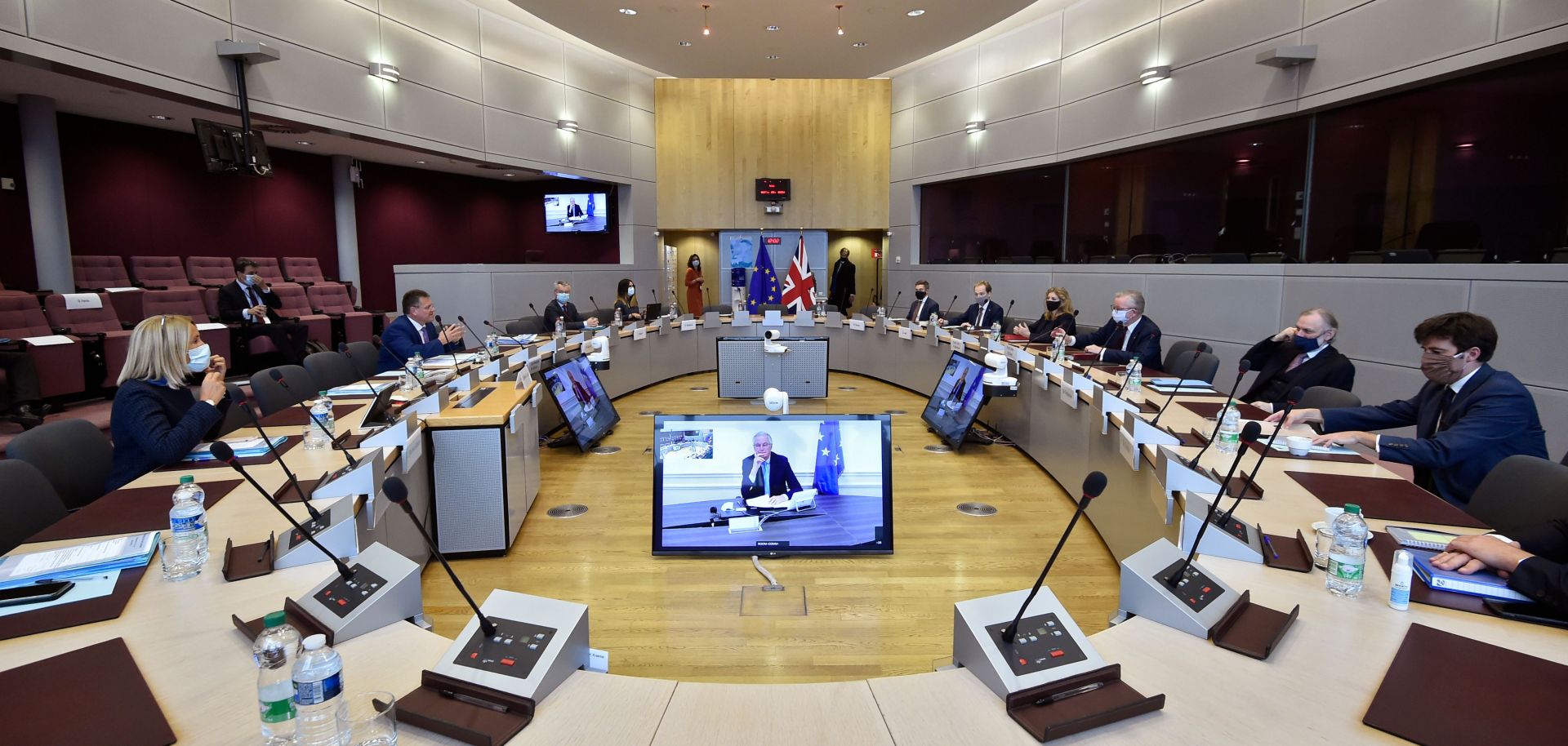 Negotiators attend the third meeting of the EU-U.K. Joint Committee under the Withdrawal Agreement in Brussels, Belgium, on Sept. 28, 2020, with the EU chief Brexit negotiator Michel Barnier (center) dialing in on video. 