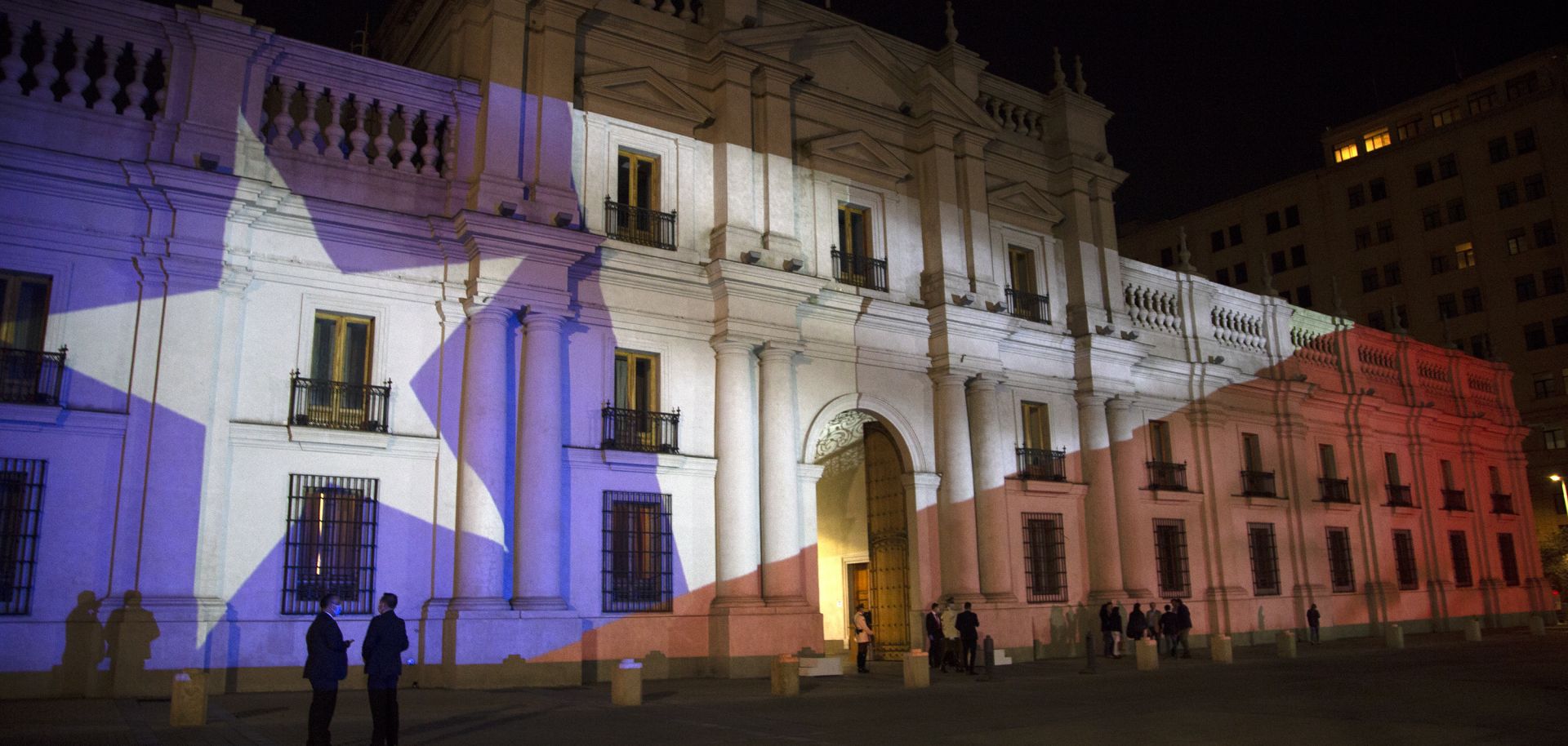 The Chilean flag is projected on the presidential palace in Santiago, Chile, on Oct. 25, 2020, after the country voted to create a new constitution. 