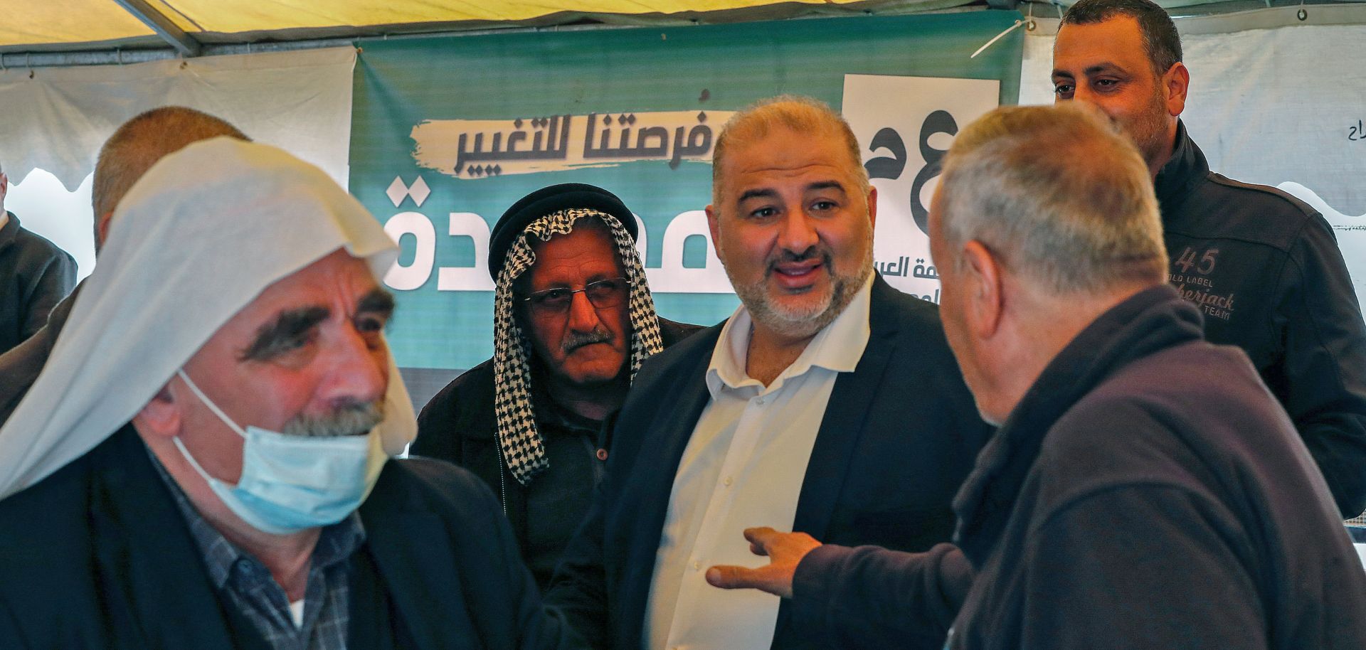 Mansour Abbas, head of Israel's Islamic Ra’am party, speaks with supporters during a rally in the northern Israeli village of Maghar on March 26, 2021.