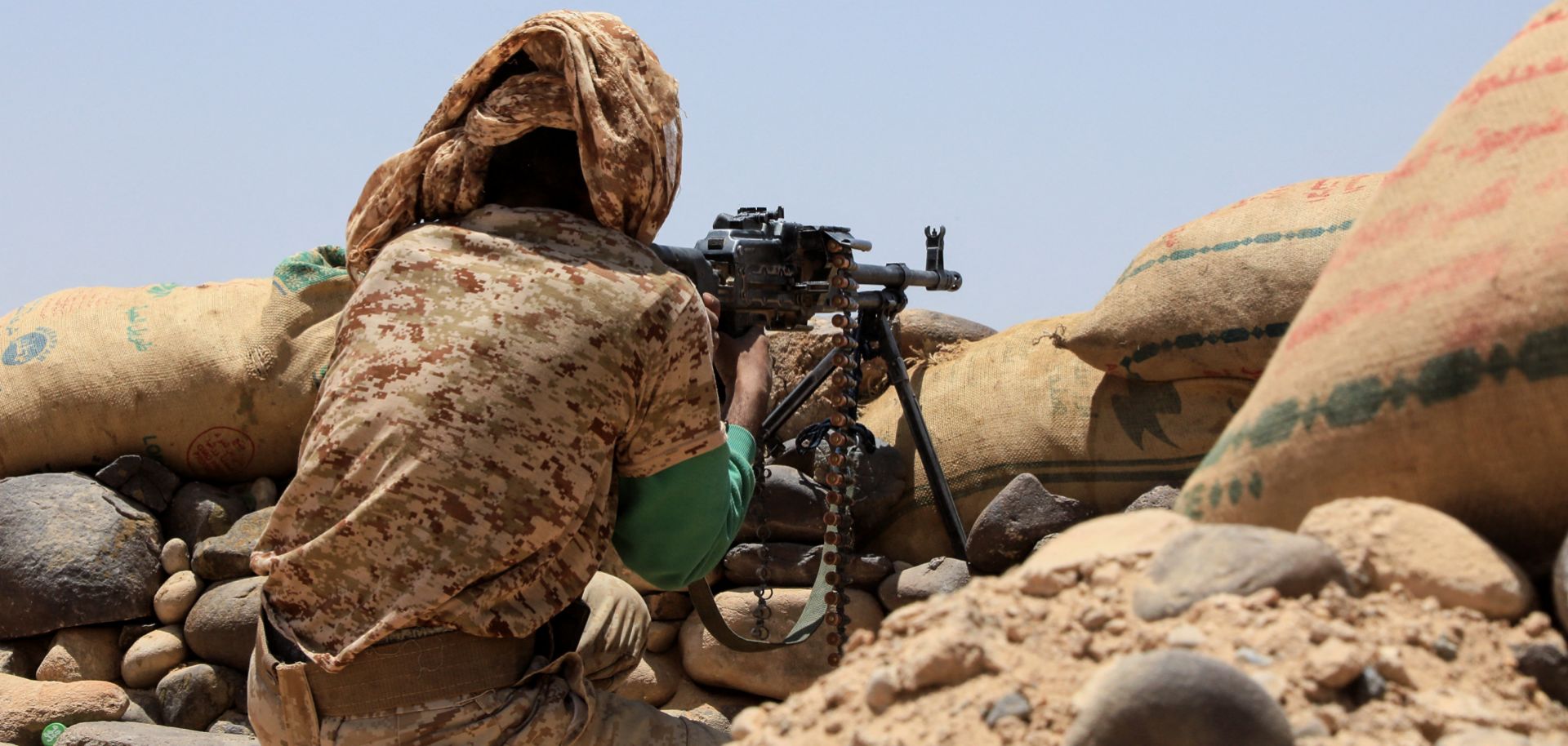 A fighter with forces loyal to Yemen's Saudi-backed government holds a position against Iran-backed Houthi rebels in the northeastern province of Marib on April 6, 2021. 