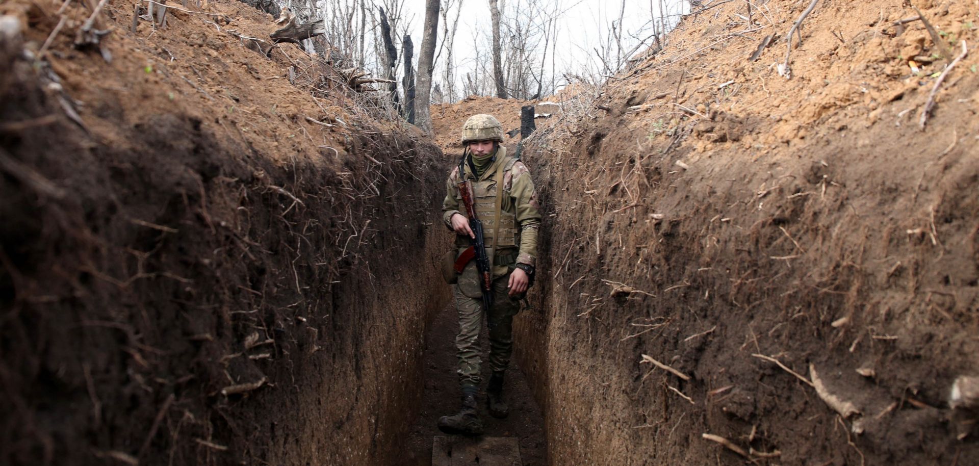 A Ukrainian serviceman in a trench on the frontline with Russia-backed separatistsApril 23, 2021, near the town of Krasnogorivka in the Donetsk region of eastern Ukraine.