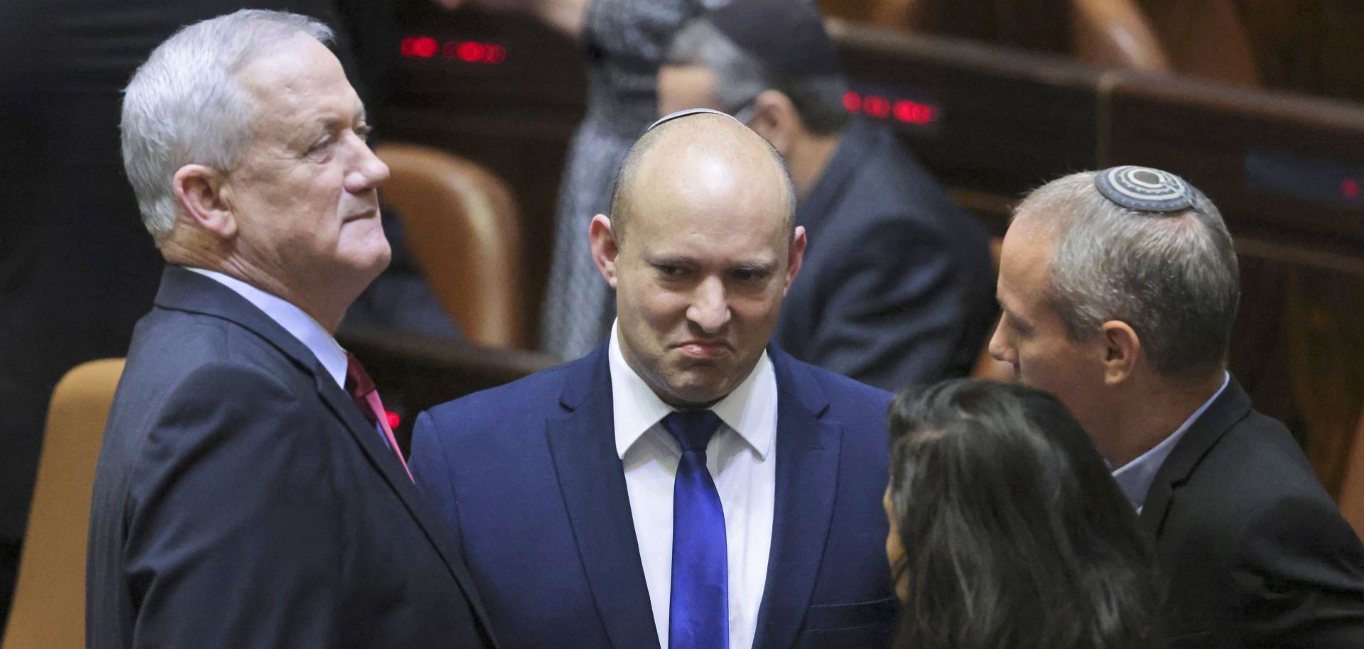 The leader of Israel’s Blue and White party, Benny Gantz (left), speaks with the leader of the right-wing Yamina party, Naftali Bennett (center) on June 2, 2021.