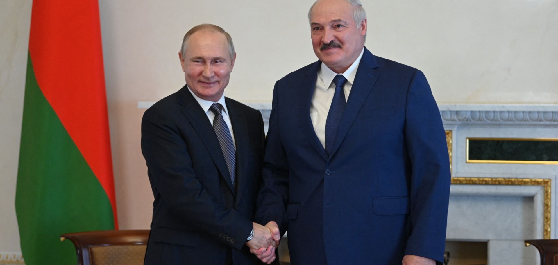 Russian President Vladimir Putin (left) shakes hands with his Belarusian counterpart Alexander Lukashenko in Saint Petersburg, Russia, on July 13, 2021. 