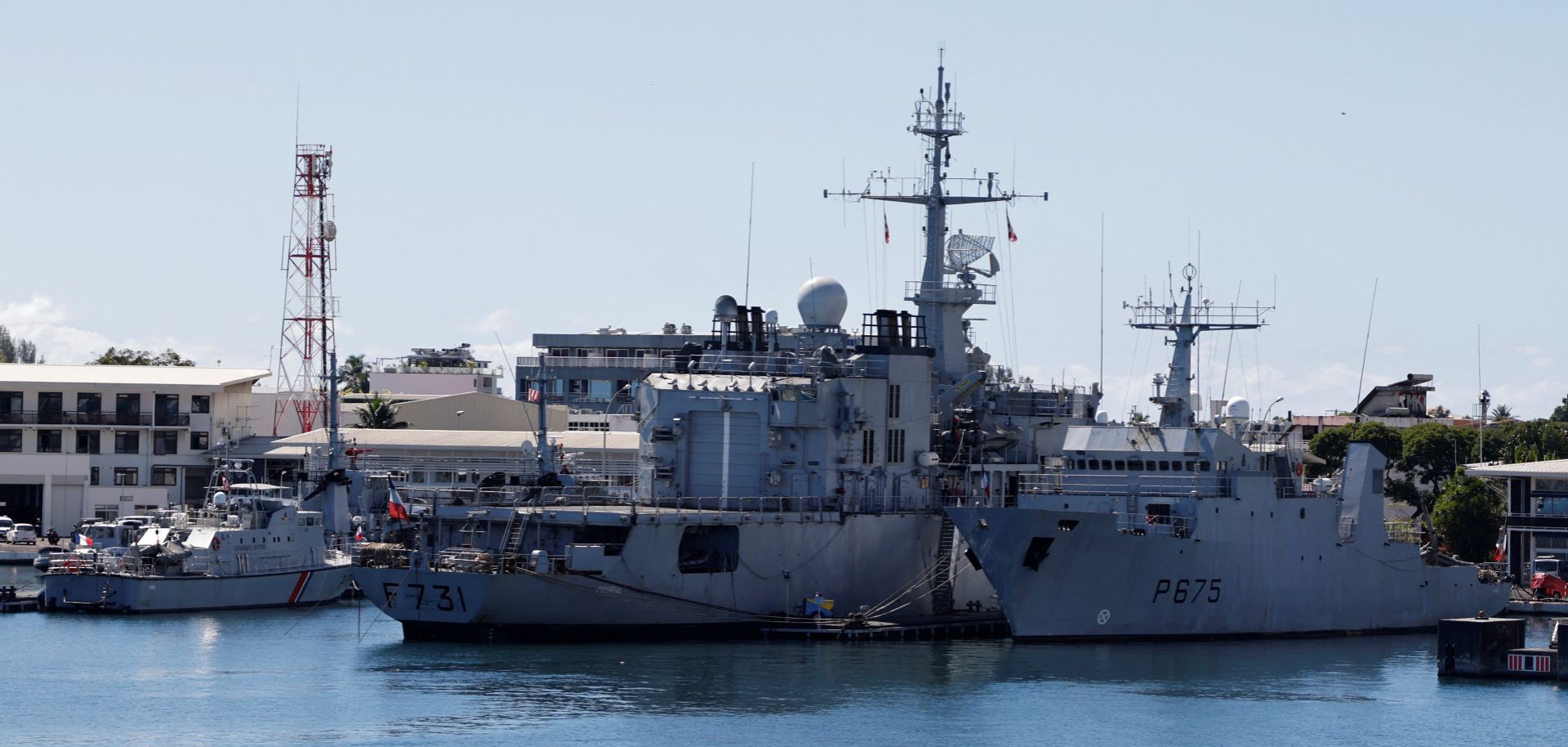 A French Navy surveillance frigate (center) and coastal patrol vessel (right) are seen moored in the harbor of Papeete, Tahiti, in French Polynesia on July 23, 2021. 