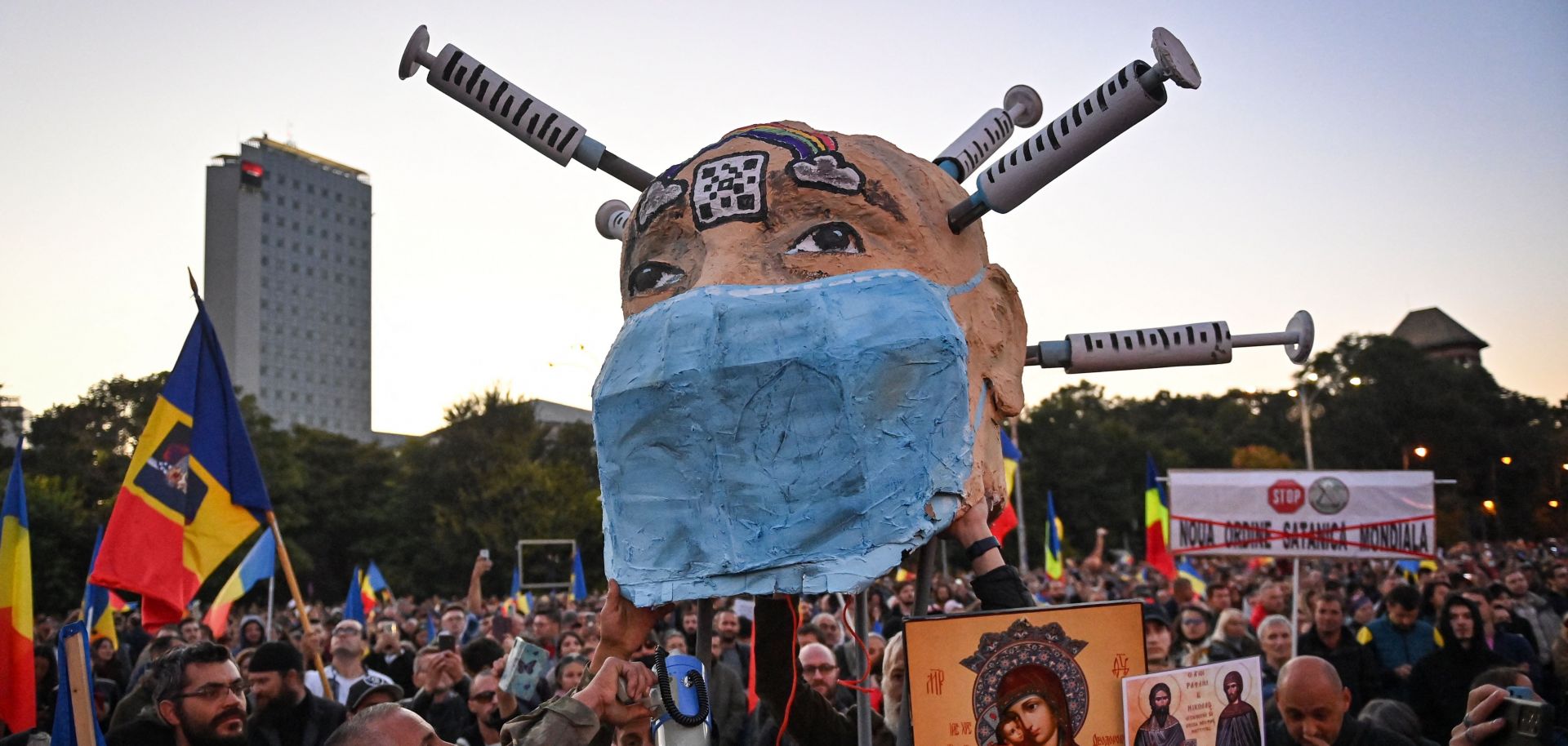 People take part in a protest against COVID-19 vaccines and lockdown measures in Bucharest, Romania, on Oct. 2, 2021.  