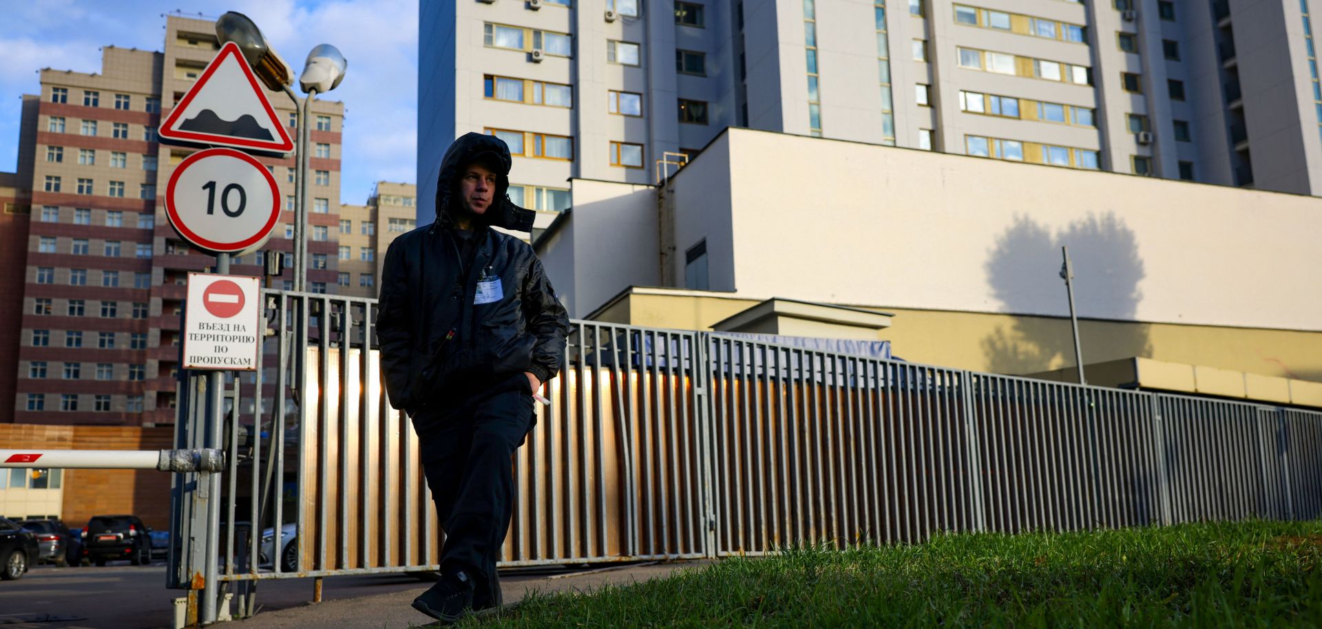 A security guard patrols outside a building that houses the NATO information office in Moscow on Oct. 18, 2021, after Russia announced it was ending the country’s mission to the Western military alliance. 