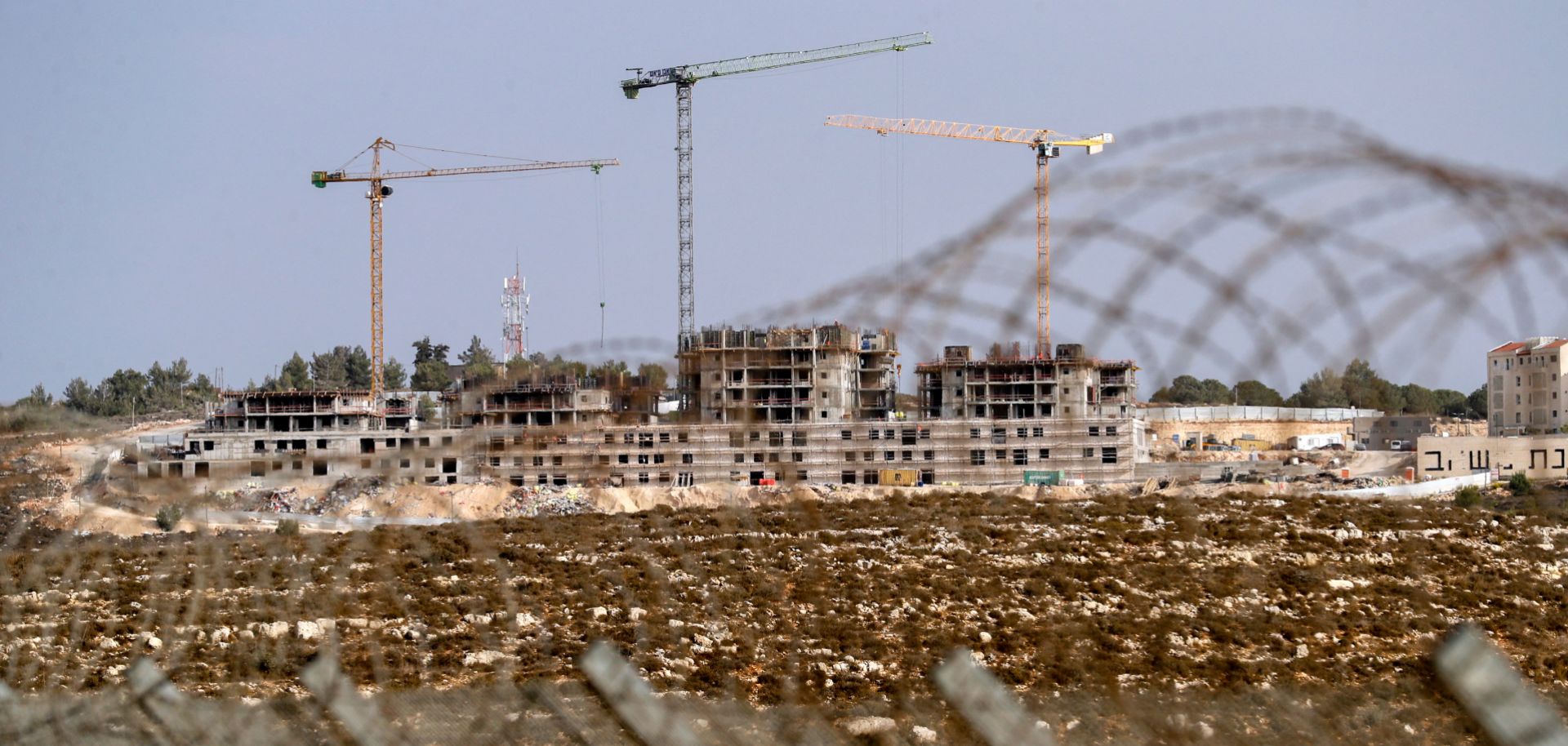 A photo taken on Oct. 28, 2021, shows ongoing construction work in an Israeli settlement near the Palestinian city of Ramallah in the West Bank. 