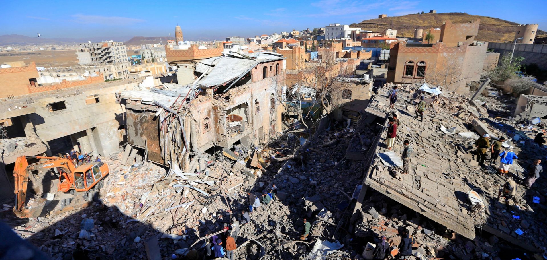 Damaged buildings in the rebel-held capital of Sanaa are seen on Jan. 18, 2022, after the Saudi-led coalition in Yemen launched airstrikes in retaliation for a deadly Houthi attack on Abu Dhabi. 
