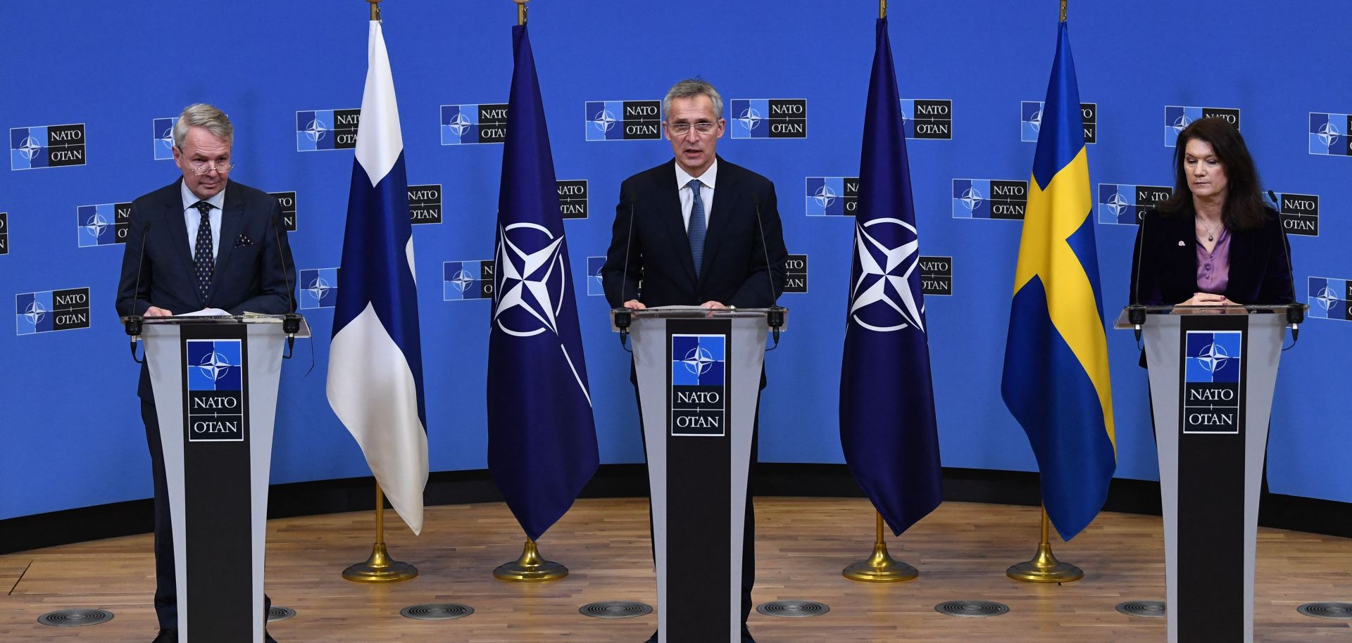 NATO Secretary-General Jens Stoltenberg (center), Finnish Foreign Minister Pekka Haavisto (left) and Swedish Foreign Minister Ann Linde (right) give a press conference after their meeting at the NATO headquarters in Brussels, Belgium, on Jan. 24, 2022. 