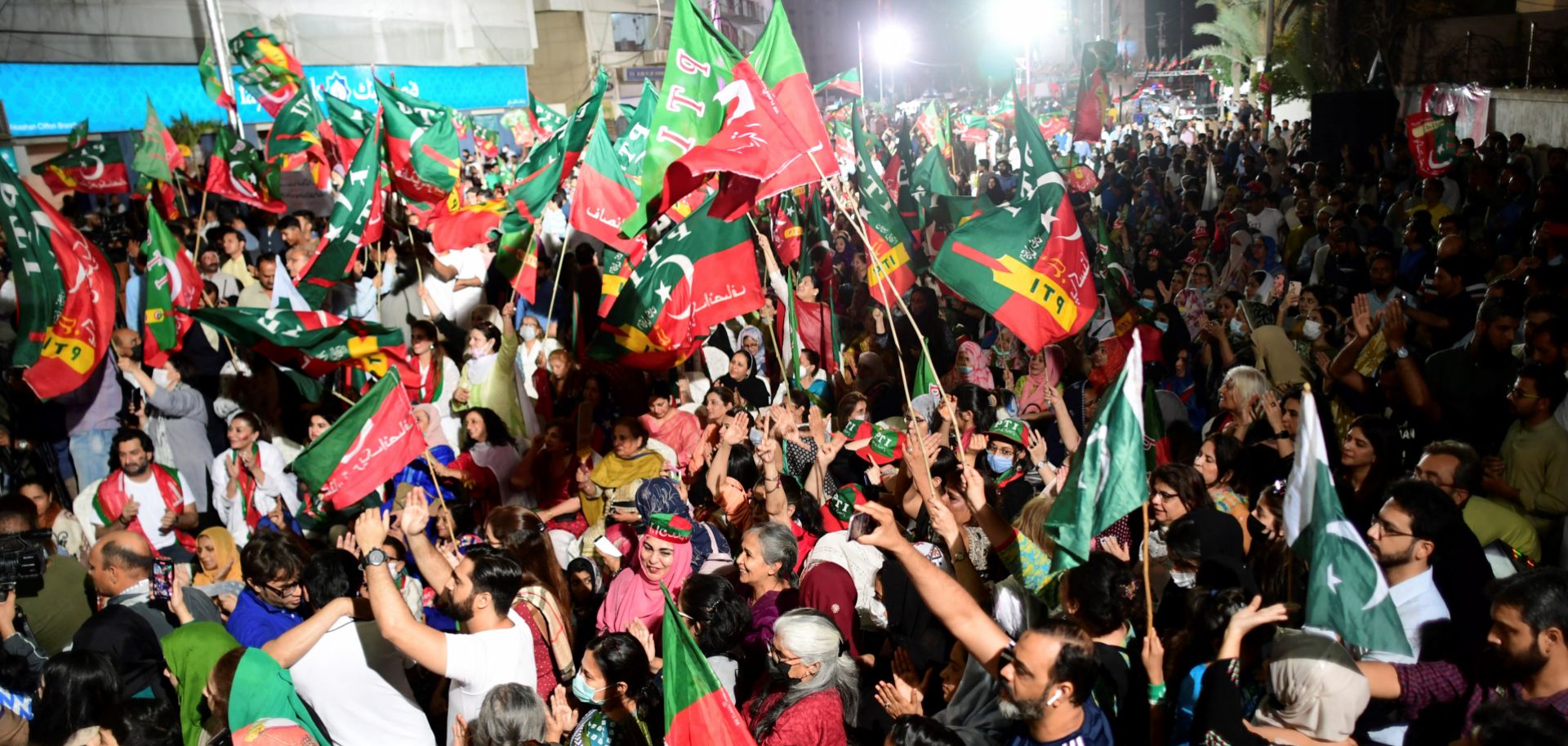 Supporters of the ruling Pakistan Tehreek-e-Insaf (PTI) party take part in a rally in Karachi on April 1, 2022, after debate on a no-confidence motion against Pakistani Prime Minister Imran Khan was postponed. 