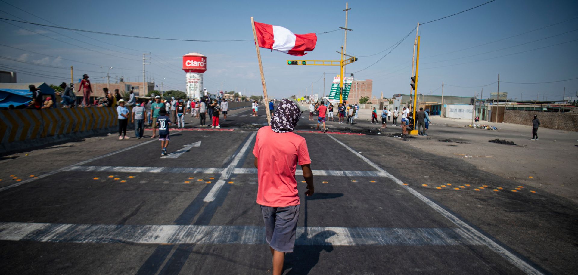 Demonstrators block a section of the Pan-American highway during a partial strike of cargo and passenger carriers in Ica, southern Peru, on April 4, 2022.