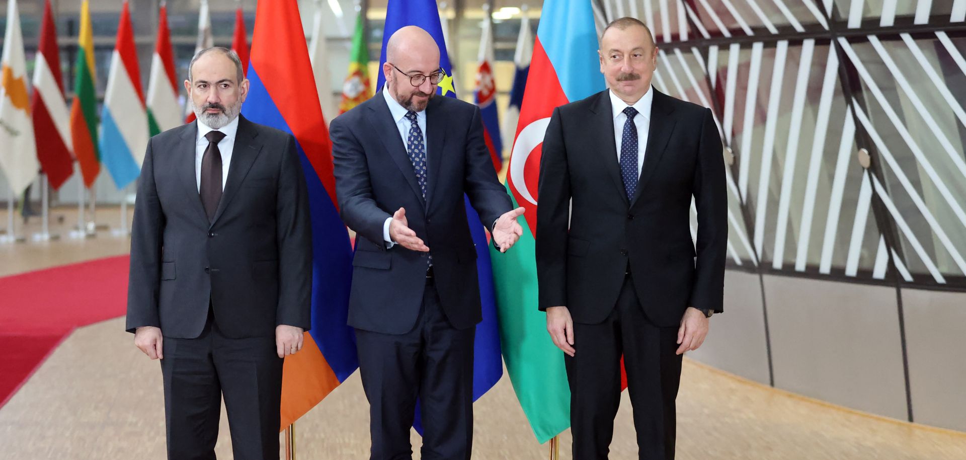 Armenian Prime Minister Nikol Pashinyan (left), European Council President Charles Michel (center) and Azerbaijani President Ilham Aliyev (right) pose for a photo in Brussels on April 6, 2022, before participating in EU-mediated talks on the Nagorno-Karabakh dispute. 