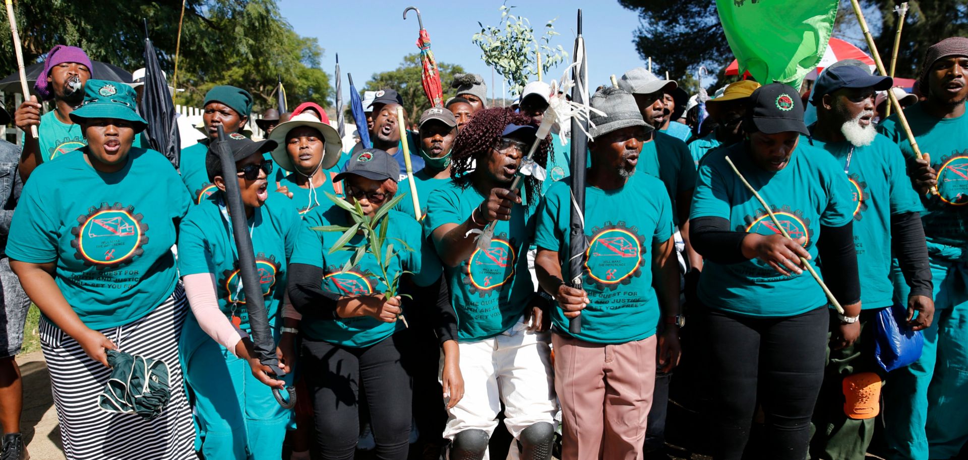 Striking workers affiliated with the Association of Mineworkers and Construction Union (AMCU) sing outside of Sibanye-Stillwater's Driefontein gold mine near Carletonville, South Africa, on May 6, 2022.
