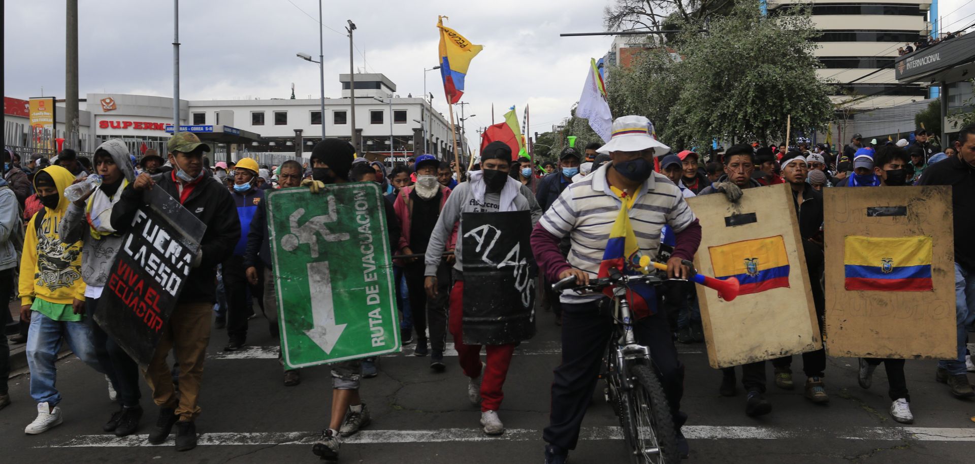 Demonstrators carry makeshift shields during the tenth day of protests against the administration of Ecuadorian President Guillermo Lasso on June 22, 2022, in Quito, Ecuador.