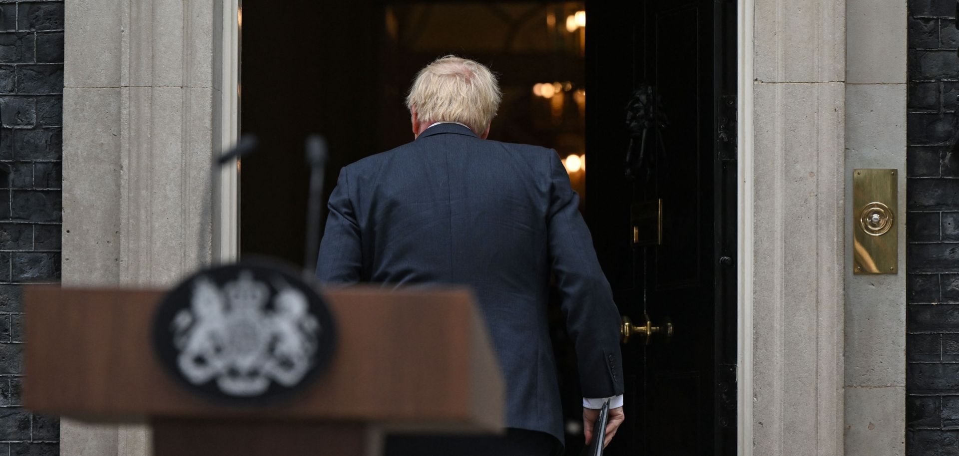 U.K. Prime Minister Boris Johnson walks back into 10 Downing Street in central London after announcing his resignation on July 7, 2022. 