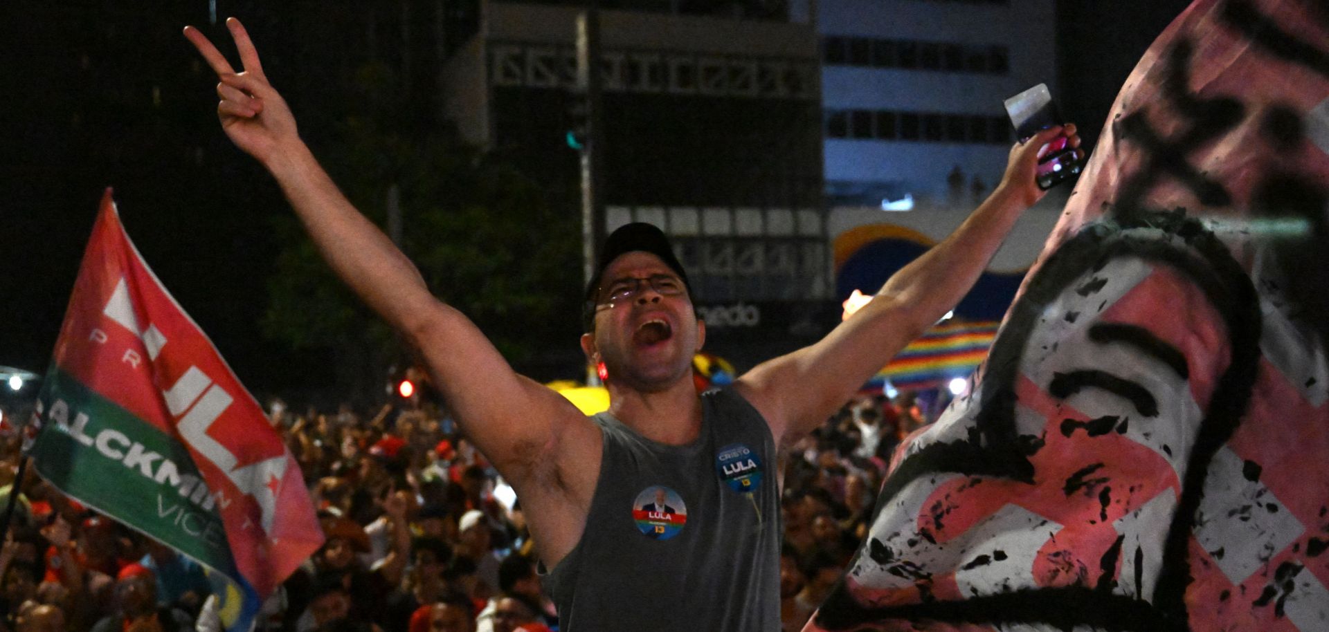 A supporter of Brazil's former left-wing president Luiz Inacio Lula da Silva celebrates on a street in Sao Paulo after da Silva was declared the winner of the country's presidential election on Oct. 30, 2022. 
