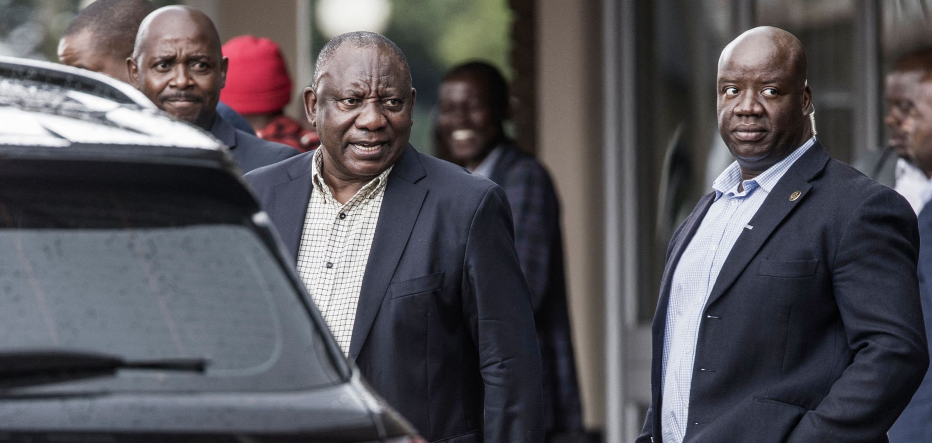 South African President Cyril Ramaphosa (center) leaves an ANC national executive committee meeting in Johannesburg on Dec. 5, 2022.