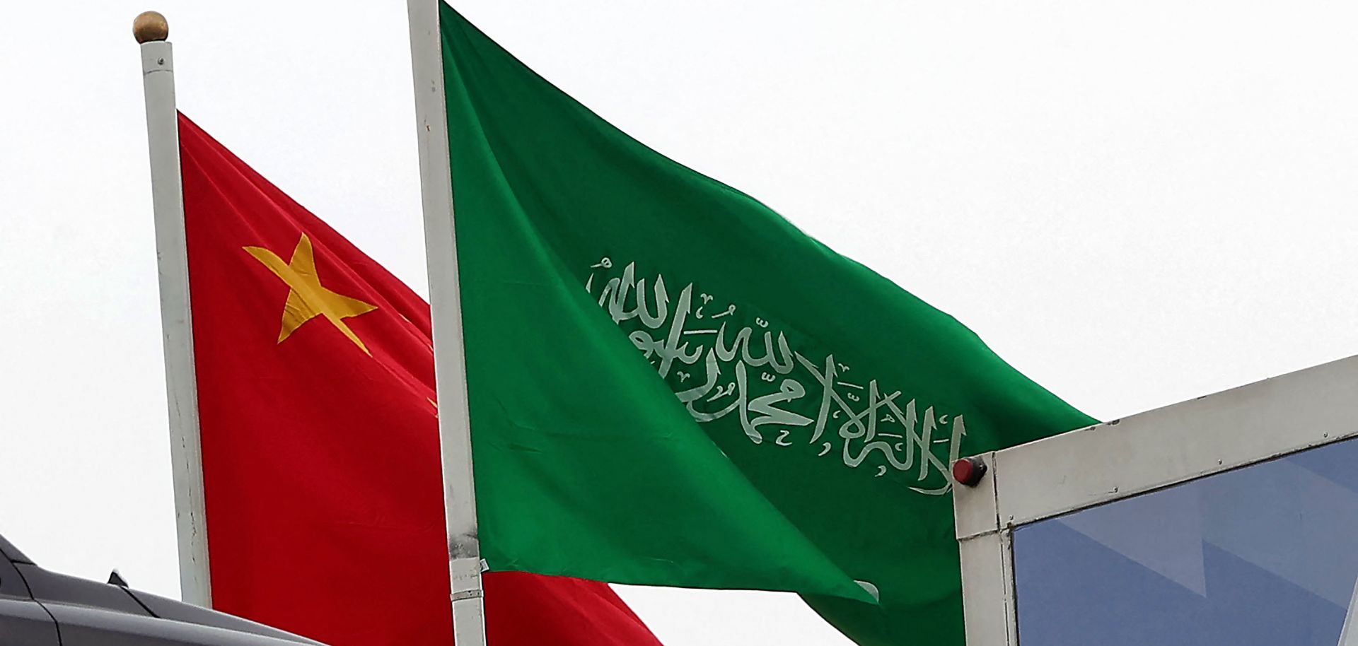 The Chinese and Saudi flags wave on a street in Riyadh on Dec. 7, 2022, ahead of Chinese President Xi Jinping's three-day visit to the Saudi capital. 