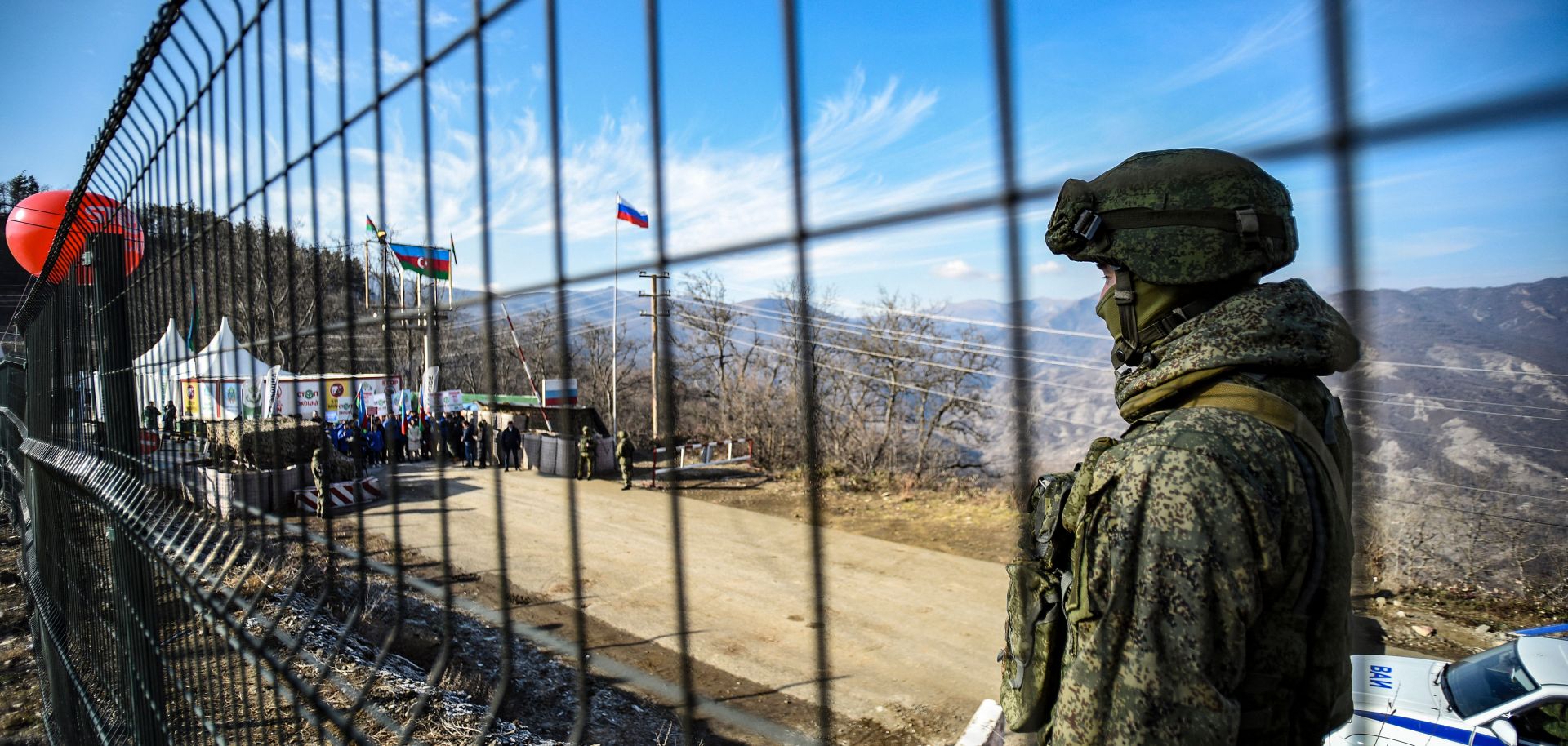 A Russian peacekeeper guards the Lachin Corridor, the breakaway Nagorno-Karabakh region's only land link with Armenia, on Dec. 27, 2022. 