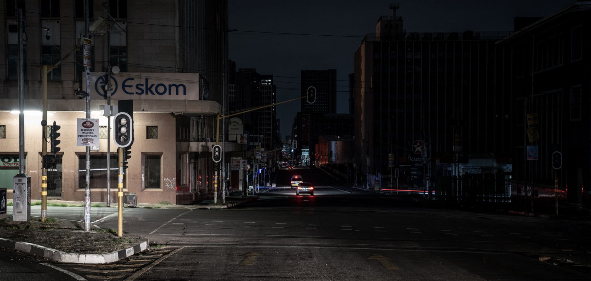 An illuminated Eskom sign is seen outside the power utility's regional office in Johannesburg, South Africa, during load-shedding (i.e. a rolling blackout) on Jan. 31, 2023.