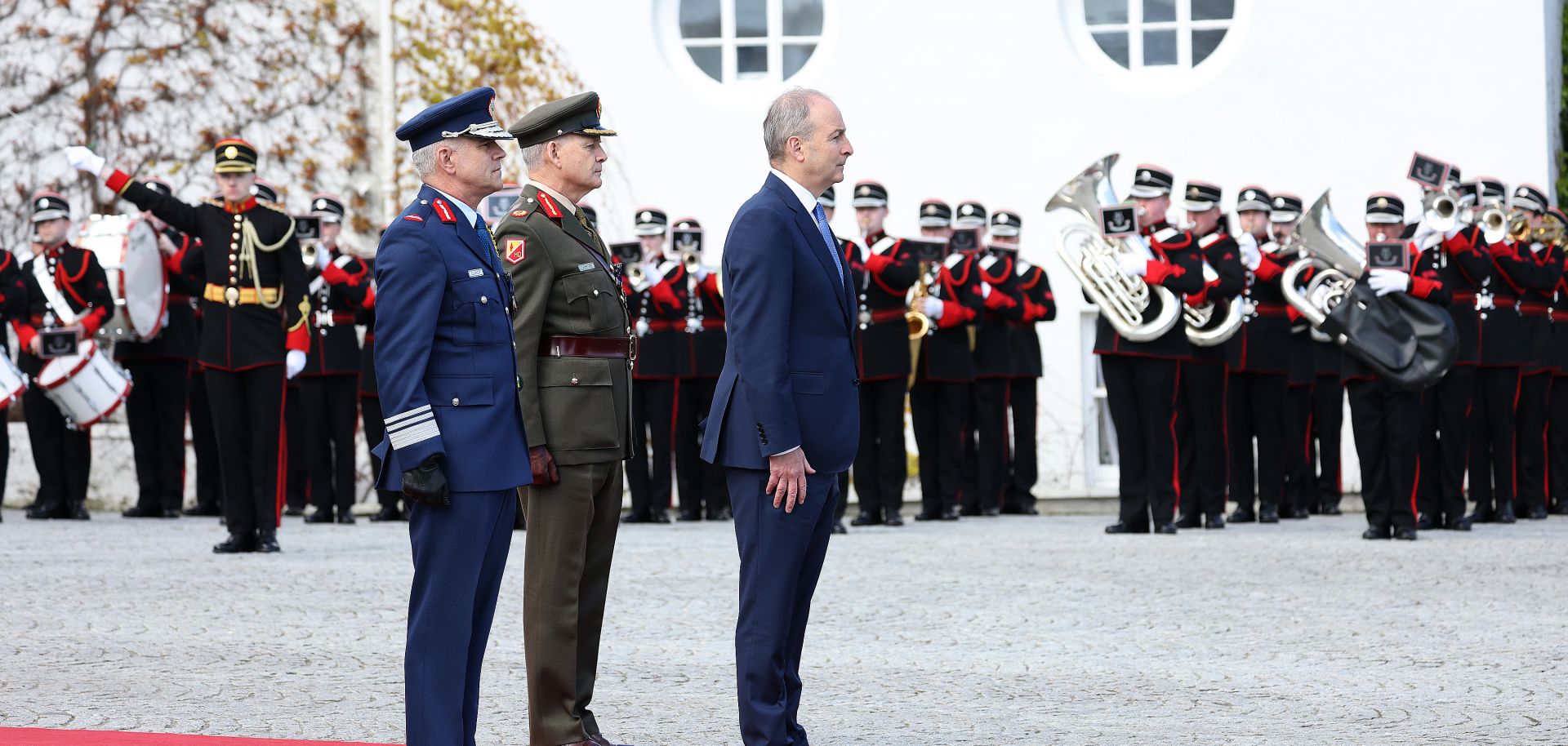 Ireland's foreign minister Micheal Martin (right), Irish Defence Forces chief Sean Clancy (left) and Brigadier General Tony Cudmore (center) meet Irish President Michael D. Higgins in Dublin, Ireland, on April 13, 2023. 