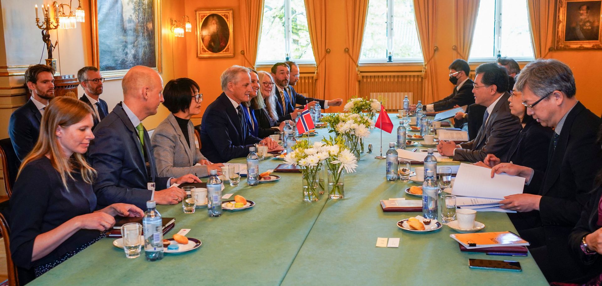 Chinese Foreign Minister Qin Gang (3rd from right), Norwegian Prime Minister Jonas Gahr Store (4th from left) and members of their delegations meet in Oslo, Norway, on May 12, 2023. 