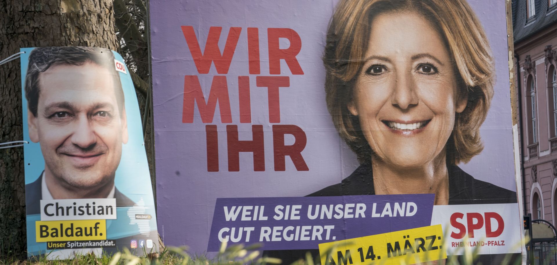 Campaign billboards featuring candidates from Germany’s Social Democratic Party (right) and Christian Democratic Union (left) are seen in Mainz, Germany, ahead of Rhineland-Palatinate state elections.