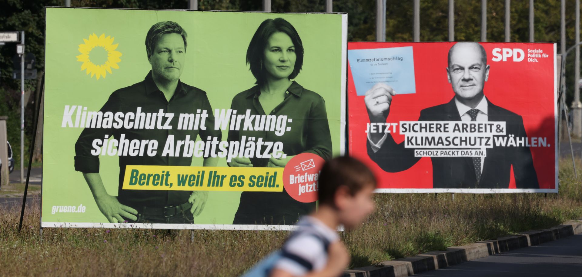 Campaign billboards in Berlin show the chancellor candidates for Germany’s Green party (left) and Social Democratic Party on Aug. 24, 2021. 