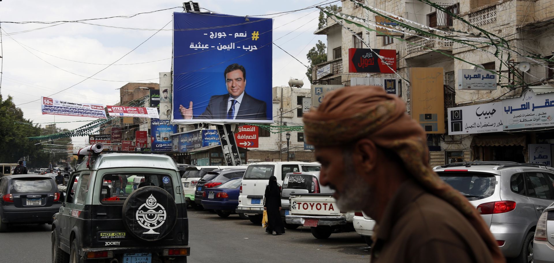 A portrait of Lebanese Information Minister George Kordahi is seen on a billboard in Sanaa, Yemen, on Oct. 31, 2021. 
