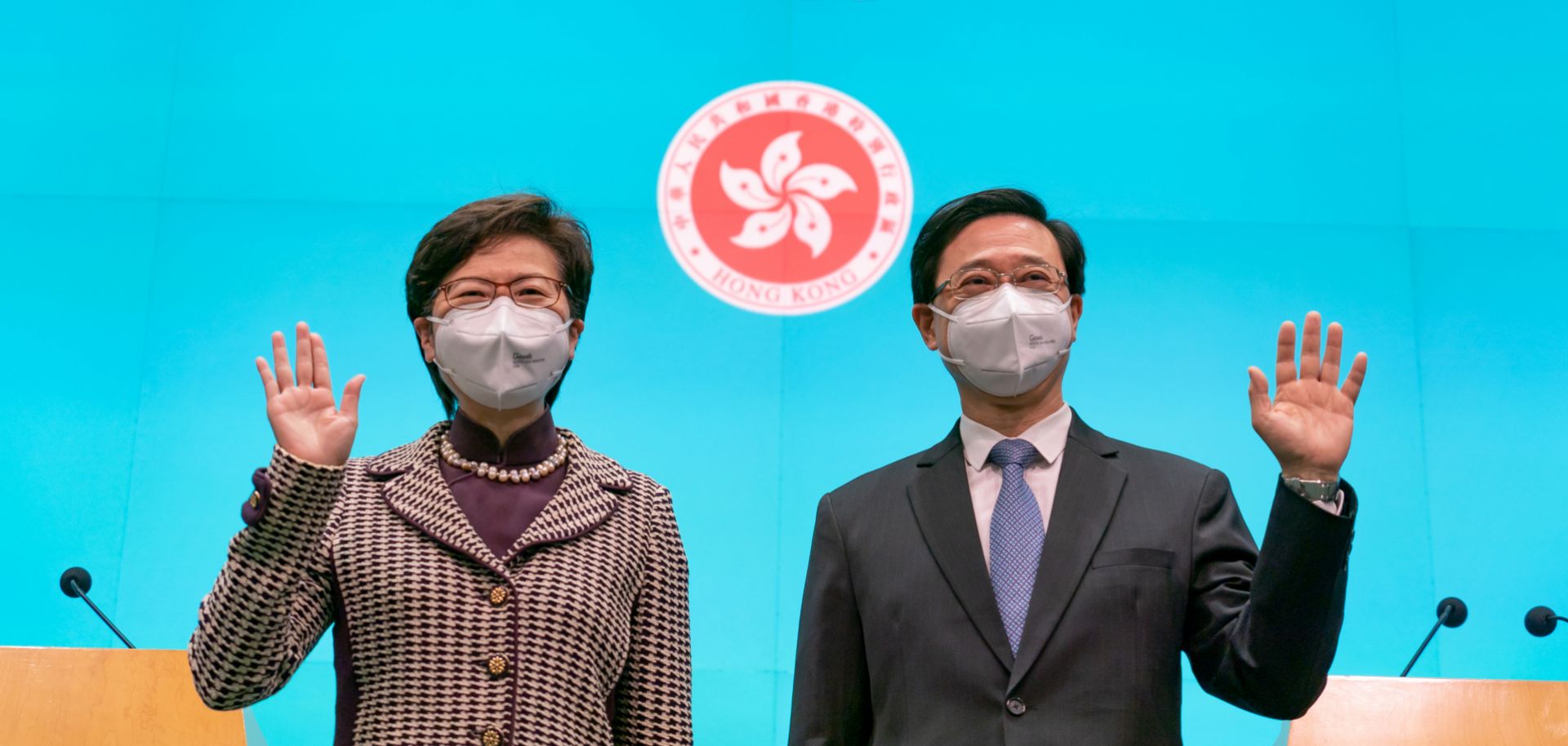 Hong Kong Chief Executive-elect John Lee (right) and current Chief Executive Carrie Lam attend a press conference at the Central Government Complex on May 9, 2022, in Hong Kong, China. 