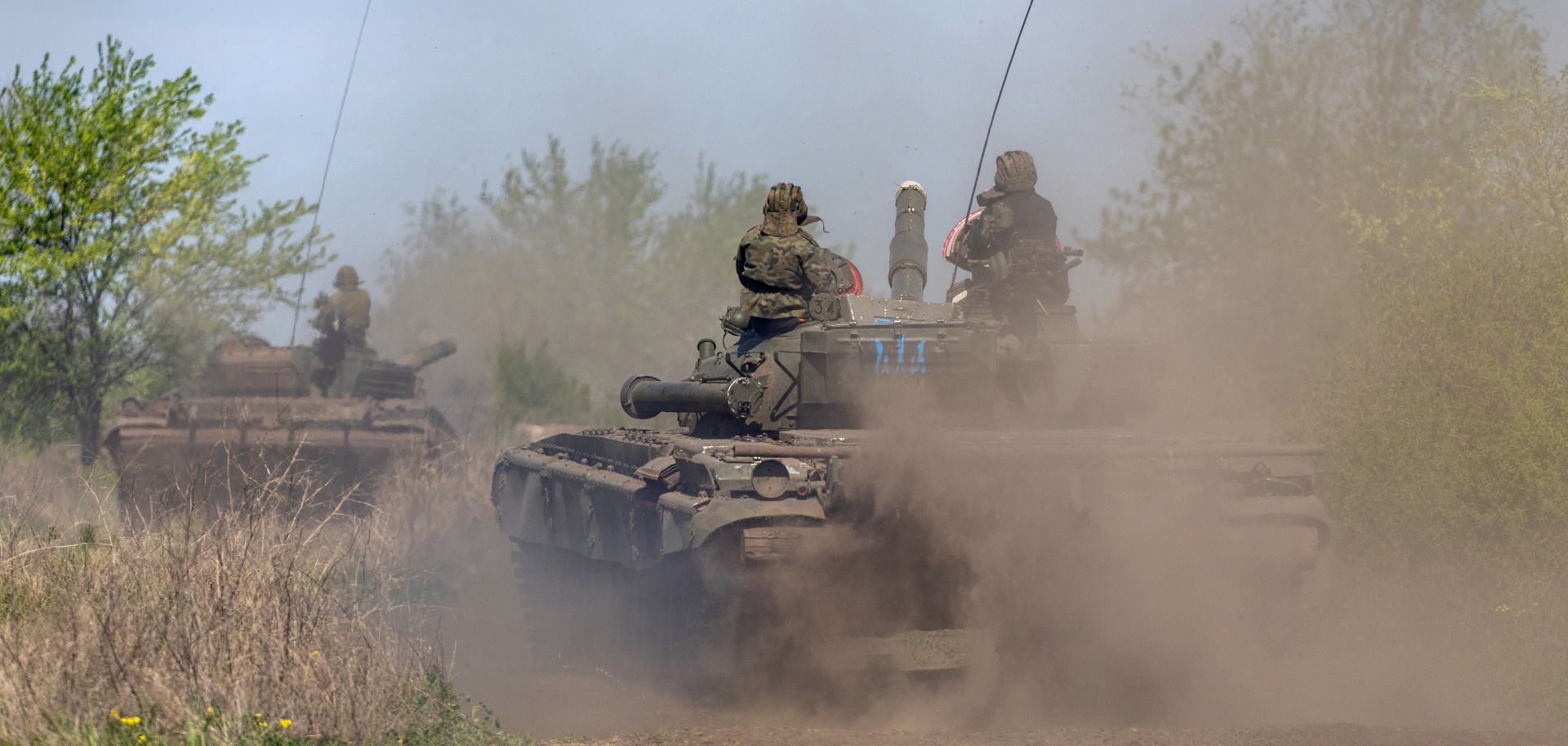 Ukrainian soldiers on tanks participate in a training exercise about 70 kilometers outside of Kherson in southern Ukraine on May 9, 2022. 