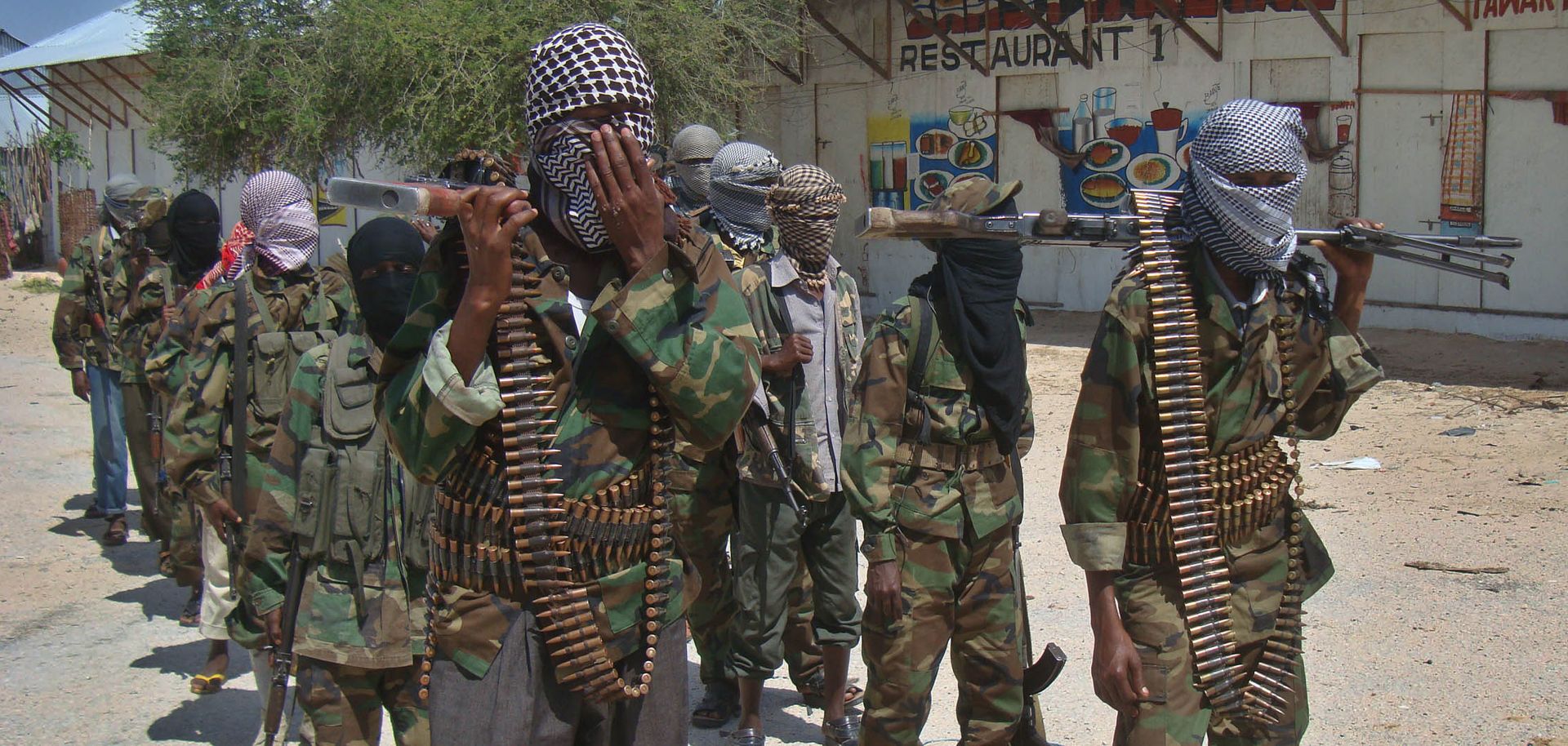 Al Qaeda-linked al Shabaab recruits walk down a street in the Somalian capital of Mogadishu following their graduation in March 2012.