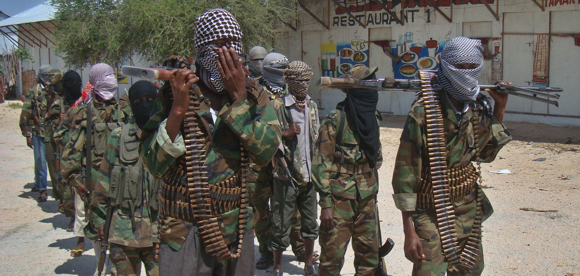 Al Qaeda-linked al Shabaab recruits walk down a street in the Somalian capital of Mogadishu following their graduation in March 2012. 