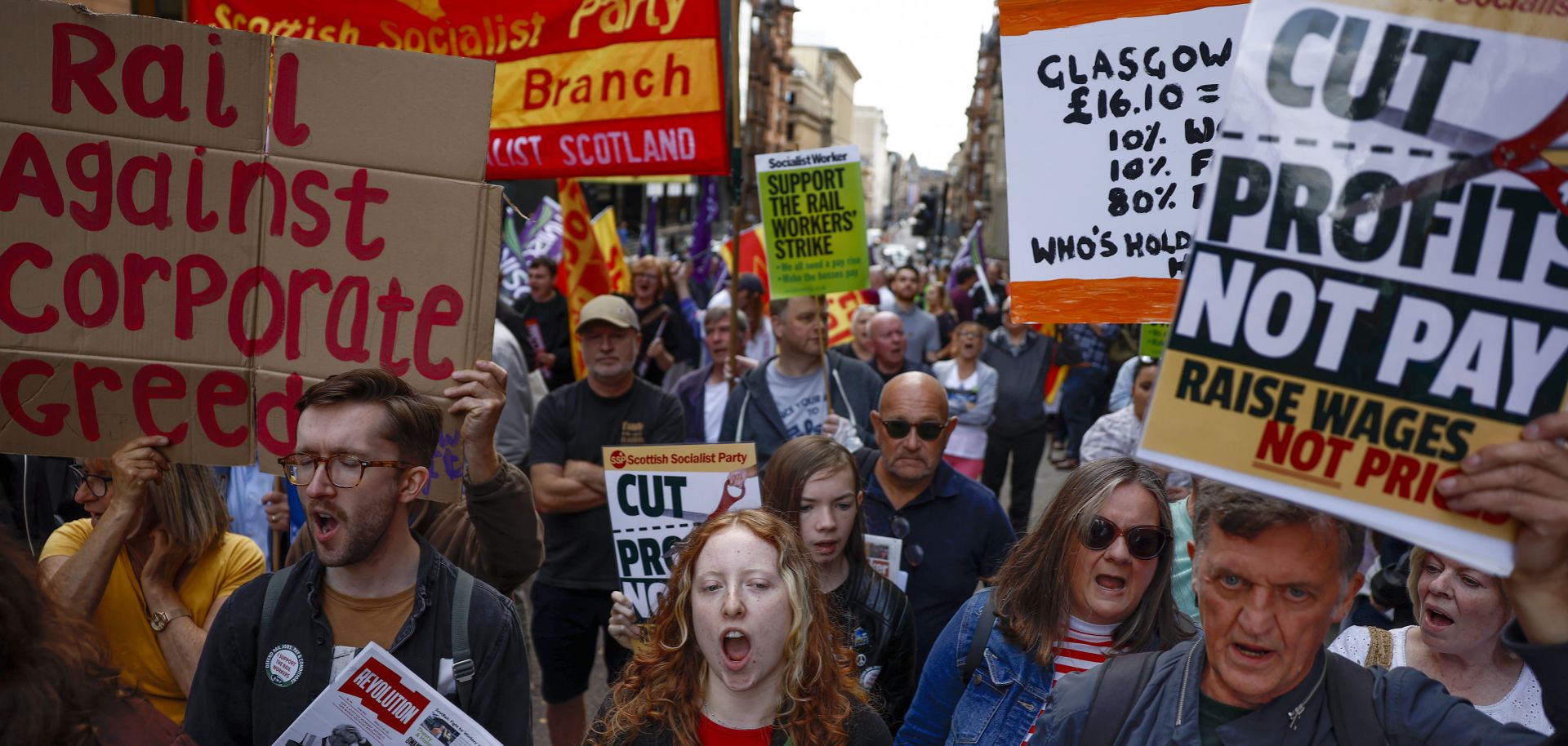 Supporters of the National Union of Rail, Maritime and Transport Workers (RMT) protest in Glasgow, Scotland, on July 27, 2022, as part of a nationwide strike among U.K. rail workers. 
