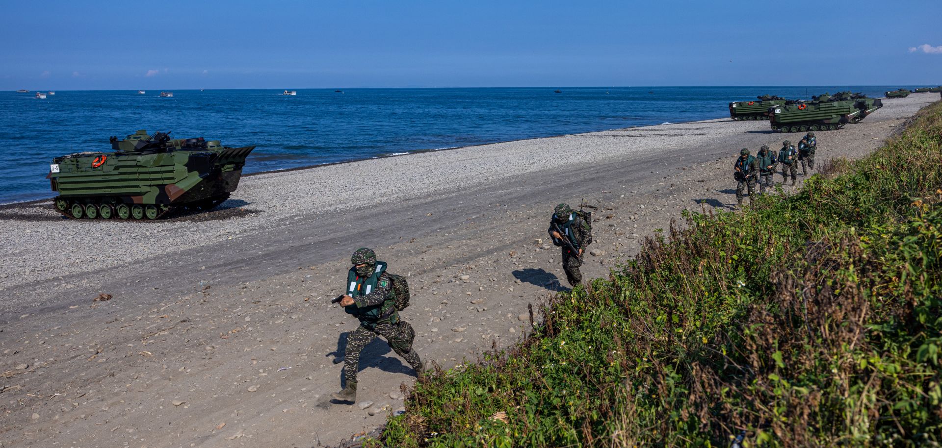 Taiwanese soldiers disembark from amphibious assault vehicles on July 28, 2022, in Pingtung, Taiwan, during a military exercise simulating a Chinese invasion.
