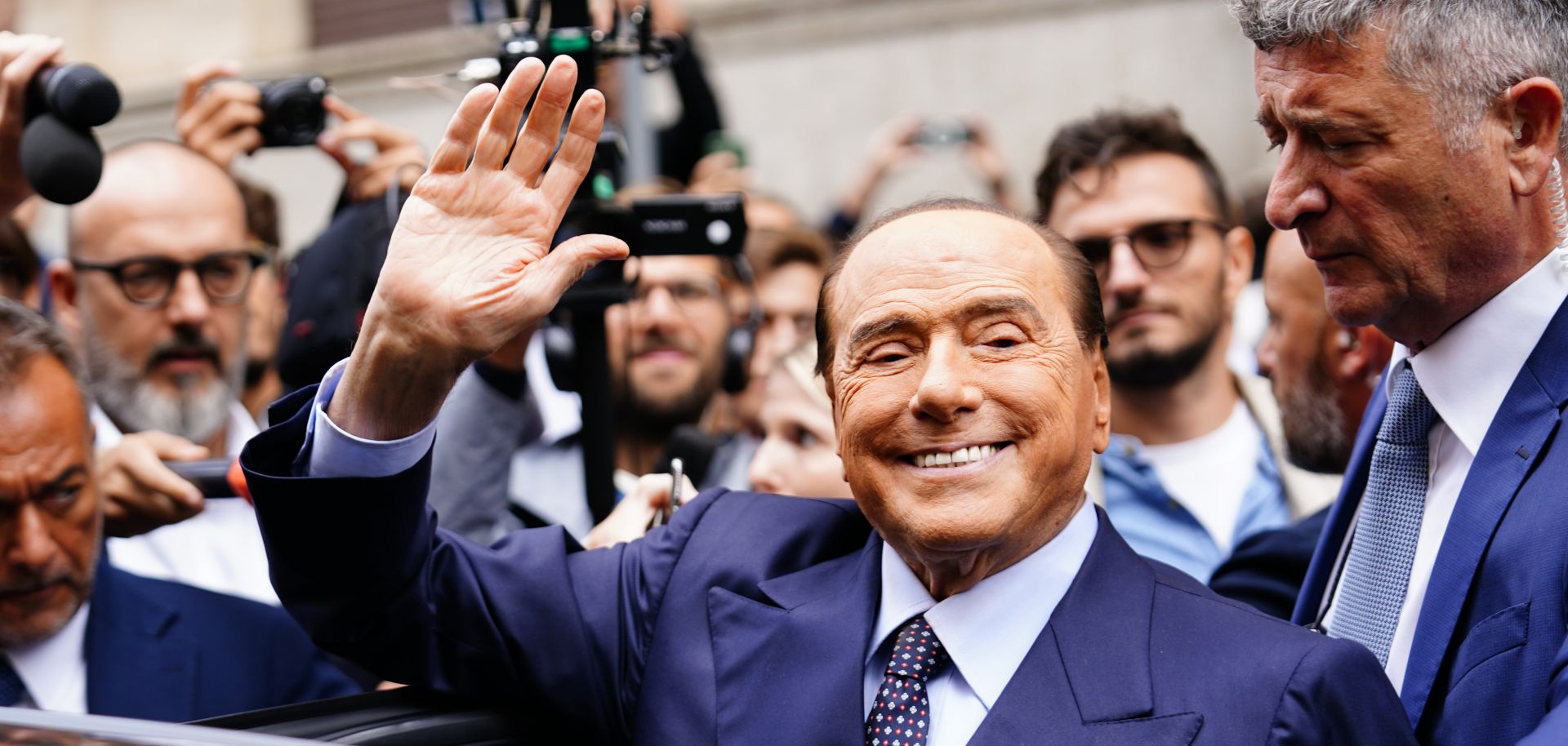 Silvio Berlusconi leaves a polling station after voting in Italy's September 2022 snap election. The former prime minister died on June 12, 2023, at the age of 86.