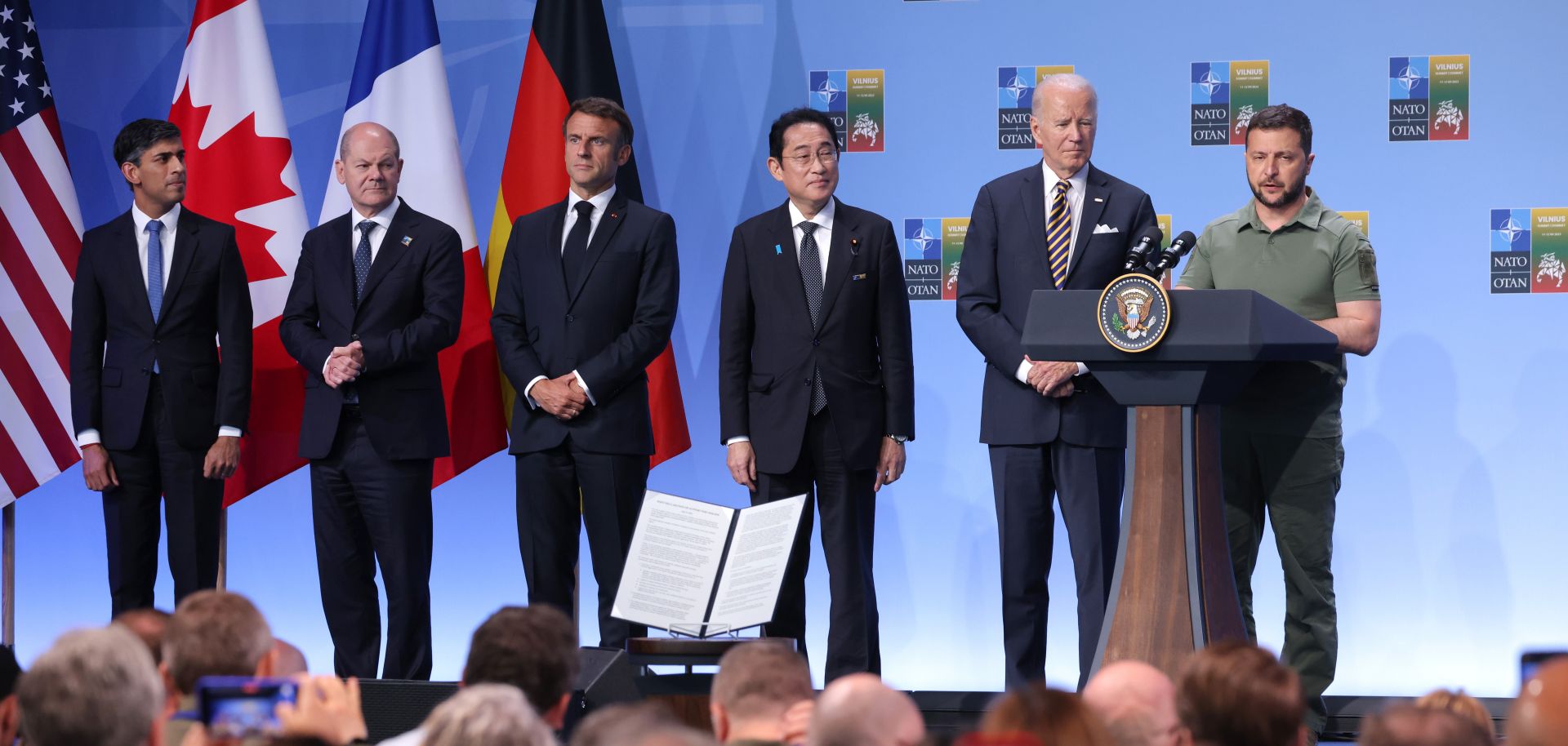 (L to R) U.K. Prime Minister Rishi Sunak, German Chancellor Olaf Scholz, French President Emmanuel Macron, Japanese Prime Minister Fumio Kishida and U.S. President Joe Biden look on as Ukrainian President Volodymyr Zelensky speaks after the announcement of a G-7 joint declaration in support of his country during the 2023 NATO summit on July 12, 2023, in Vilnius, Lithuania.