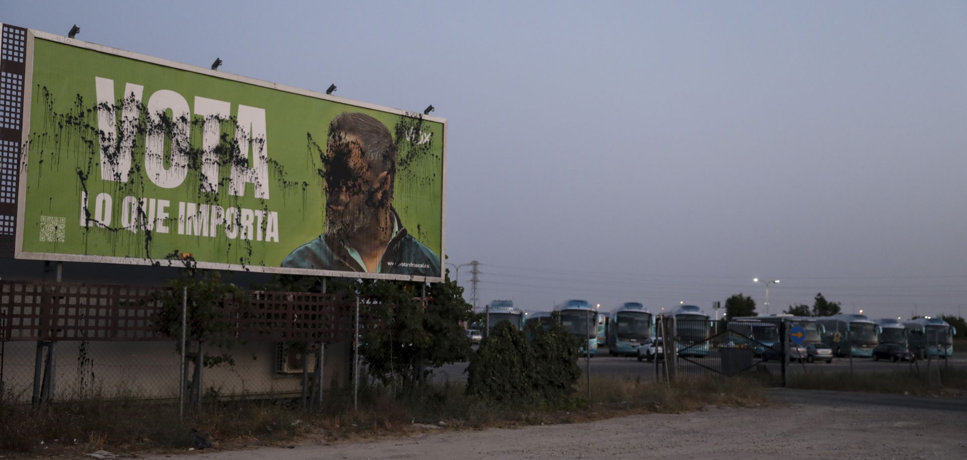 A vandalized billboard promoting Spain's far-right Vox party with an image of its leader is seen near Madrid on July 19, 2023. 