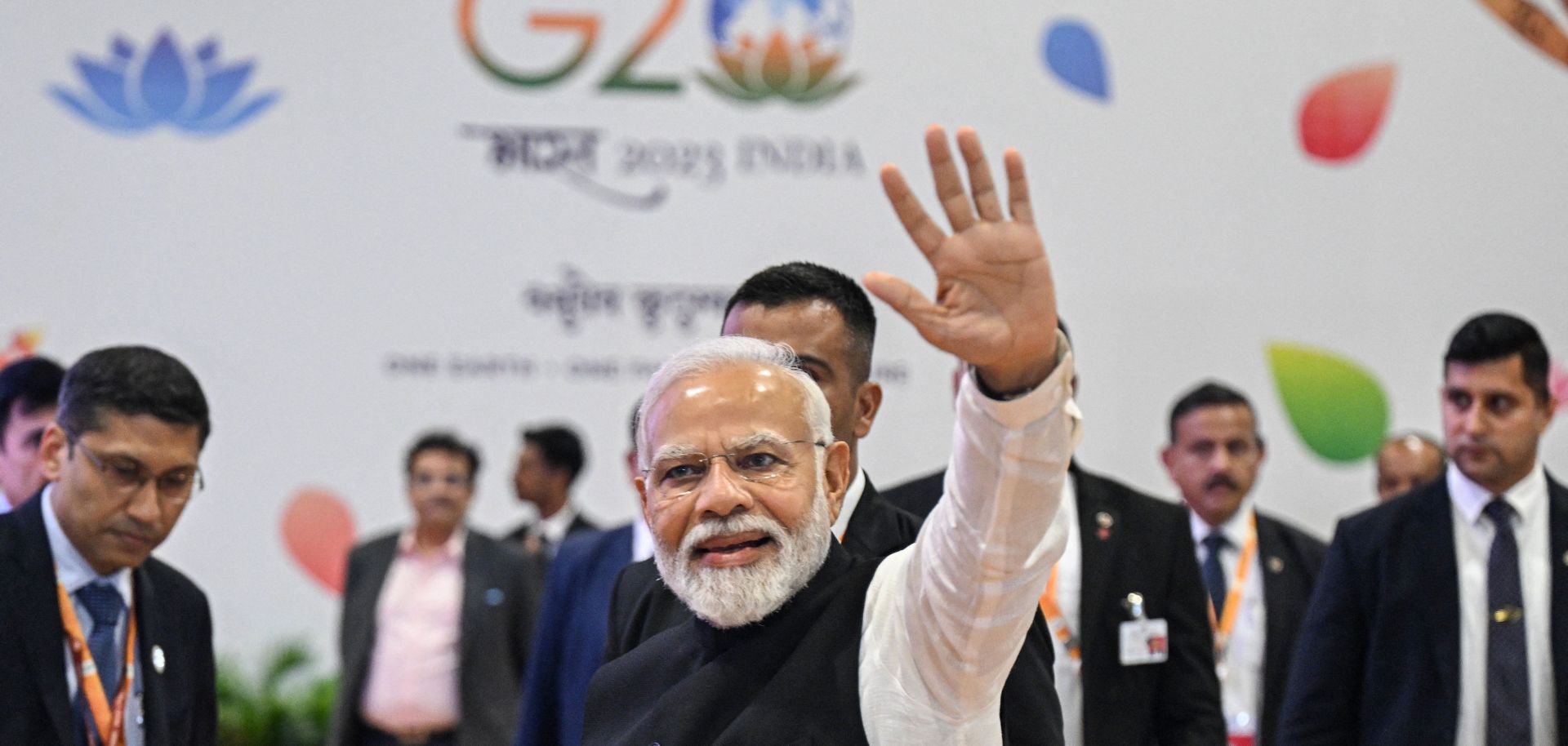 Indian Prime Minister Narendra Modi (center) waves to reporters at the G20 summit venue in New Delhi, India, on Sept. 10, 2023. 