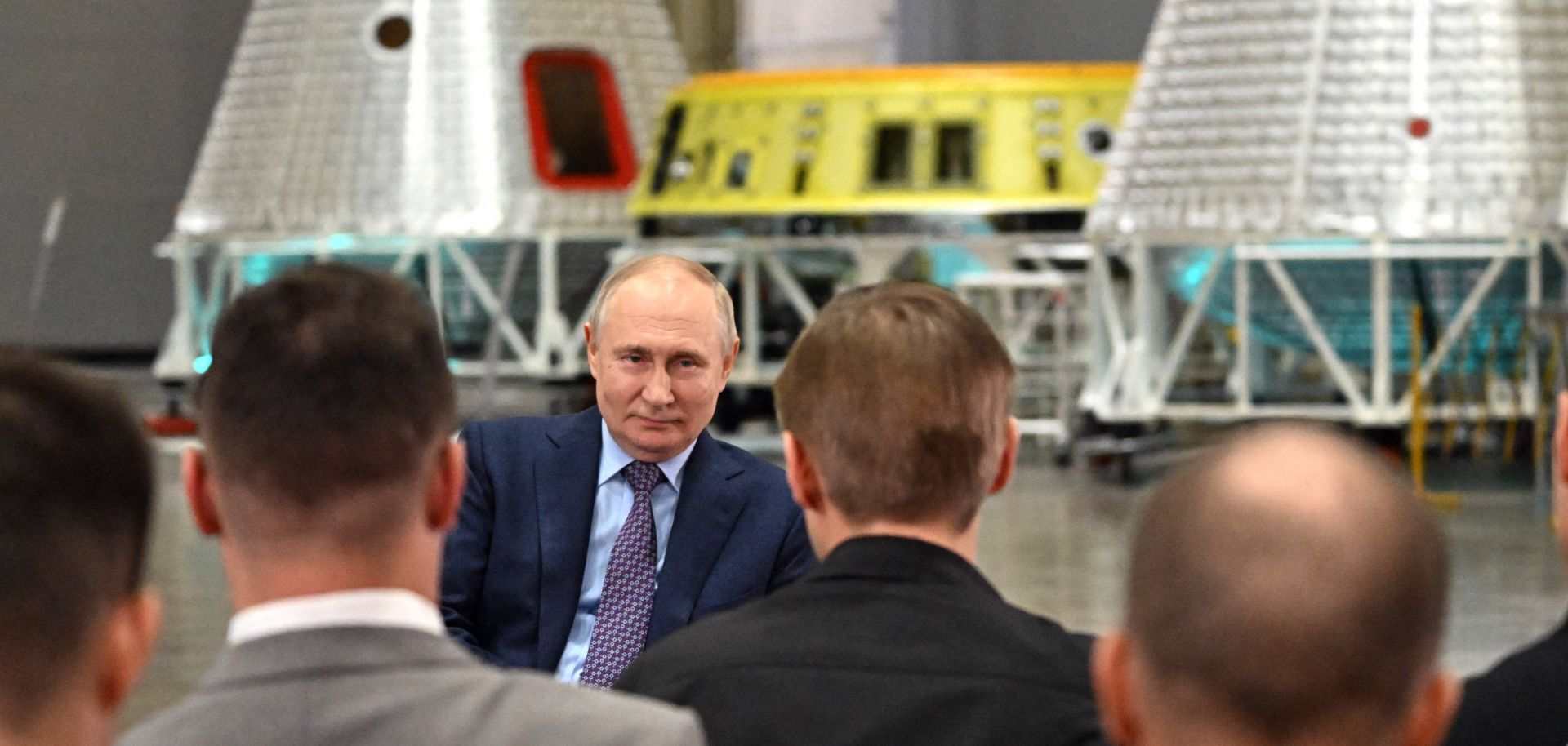 Russian President Vladimir Putin talks with scientists during a visit to the Rocket and Space Corporation (RSC) Energia in Korolyov, outside Moscow, on Oct. 26, 2023. 