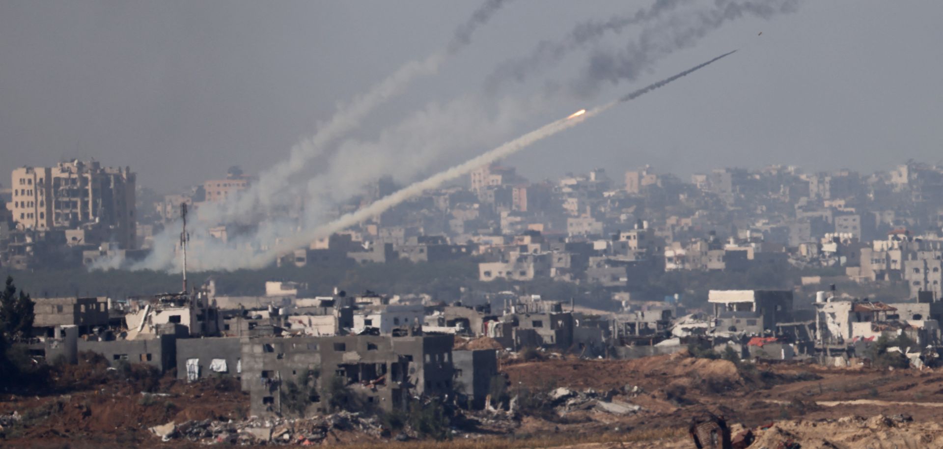 A photo taken from southern Israel near the border with the Gaza Strip shows a rocket being fired from inside Gaza toward Israel, as fighting resumed between the Israeli forces and Hamas militants after a temporary cease-fire expired on Dec. 1, 2023.