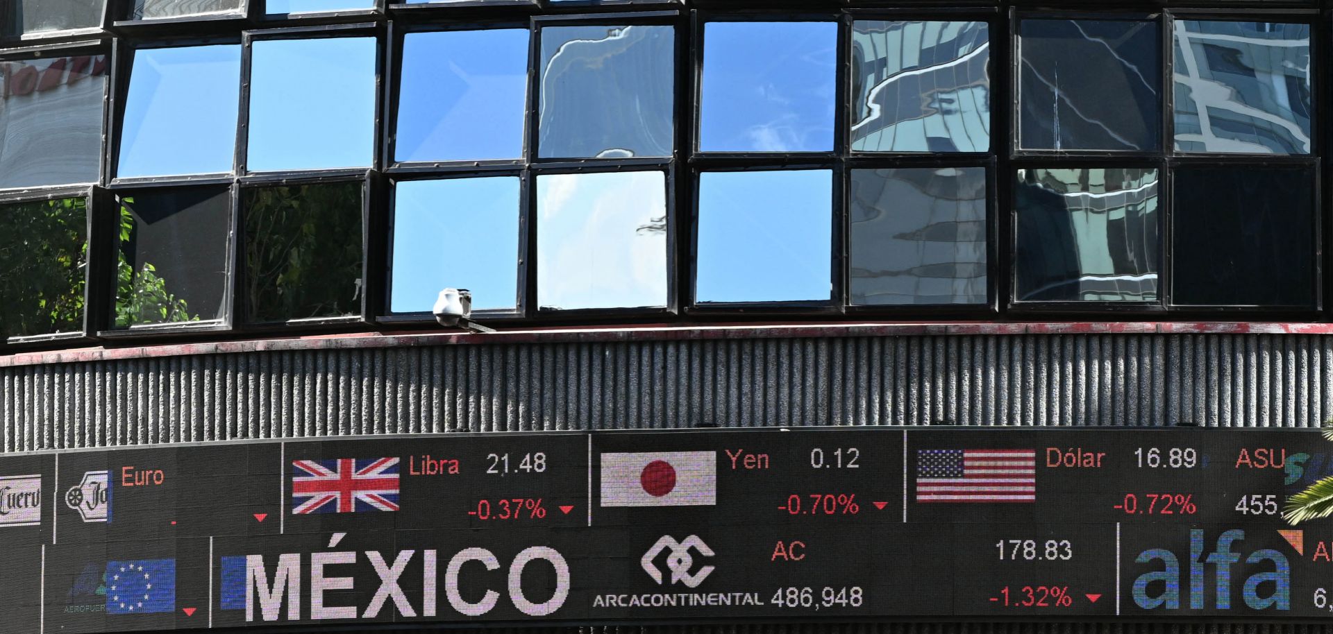 Different currency exchanges are seen outside the Mexican Stock Exchange building at Reforma Avenue in Mexico City on Jan. 5, 2024. 