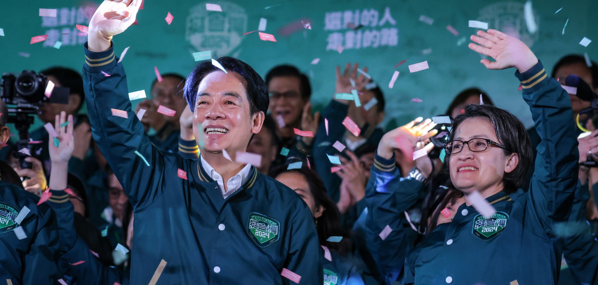 Taiwanese President-Elect, William Lai (left), celebrates alongside his running mate (right) during a rally at the headquarters of the Democratic Progressive Party (DPP) in Taipei, Taiwan, on Jan. 13, 2024, after winning the presidential election.