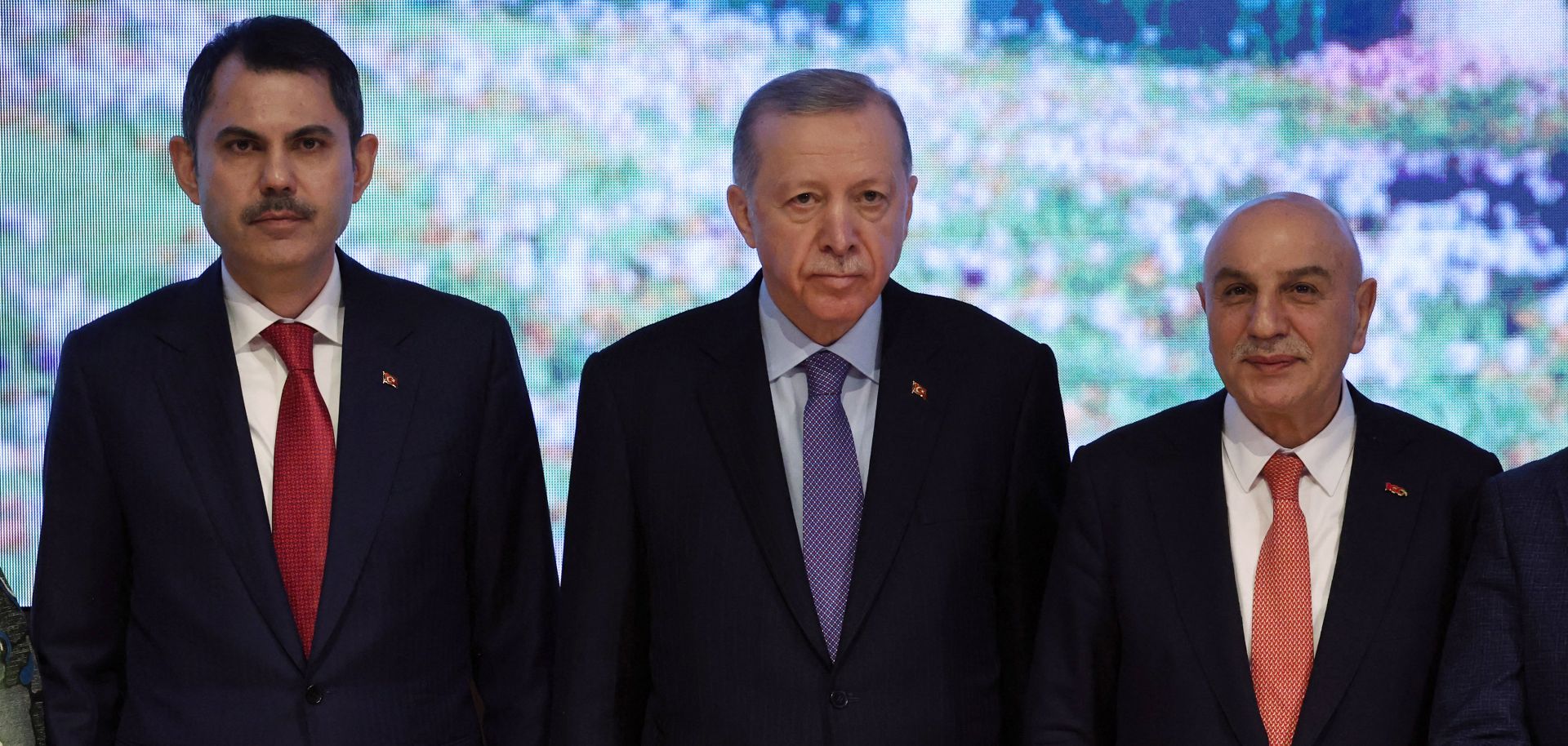 Turkish President Recep Tayyip Erdogan (center) poses with Istanbul mayoral candidate Murat Kurum (left) and Ankara mayoral candidate Turgut Altinok (right) during the presentation of the Justice and Development Party's election manifesto in Ankara, Turkey, on Jan. 30, 2024.