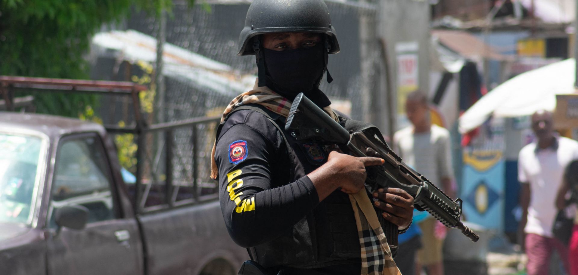 A Haitian police officer controls the area around the country's National Palace in Port-au-Prince on May 1, 2024.