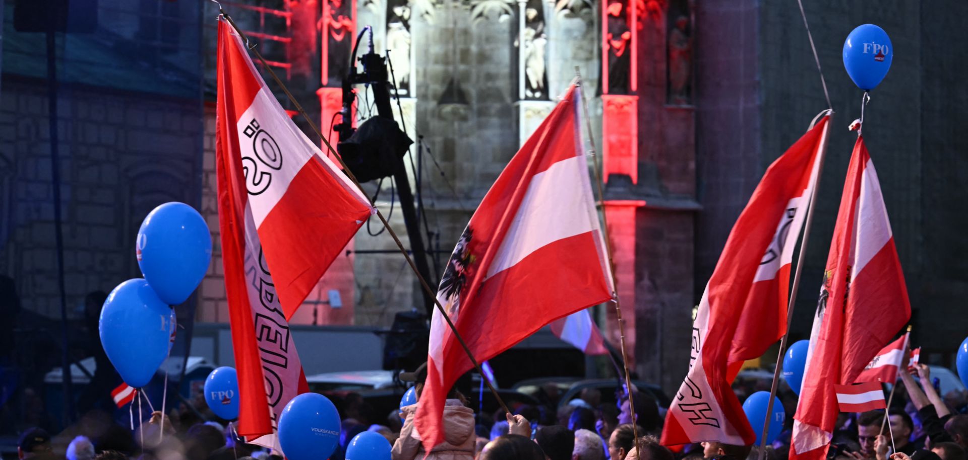 Supporters of the far-right Freedom Party of Austria (FPO) wave flags during an election rally in Vienna, Austria, on Sept. 27, 2024. 