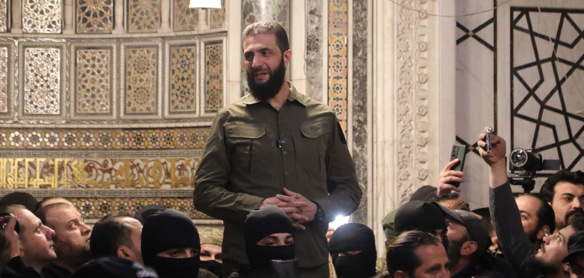 Syria’s de-facto leader Ahmad al-Sharaa addresses a crowd at a mosque in Damascus on Dec. 8, 2024.